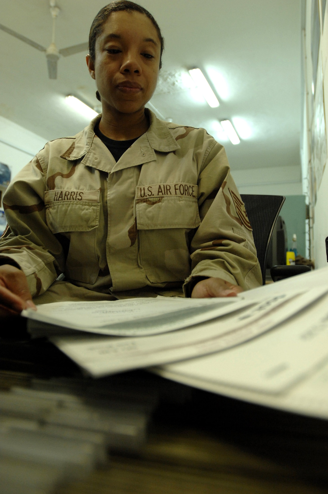 Tech. Sgt. Lisa Harris takes out a test form from the file Dec. 11 at Ali Base, Iraq. The 407th Expeditionary Services Squadron Education Center gives servicemembers the opportunity to further their educational and career development. Sergeant Harris is assigned to the 407th Expeditionary Services Squadron and is deployed from Andrews Air Force Base, Md. (U.S. Air Force photo/Airman 1st Class Jonathan Snyder) 
