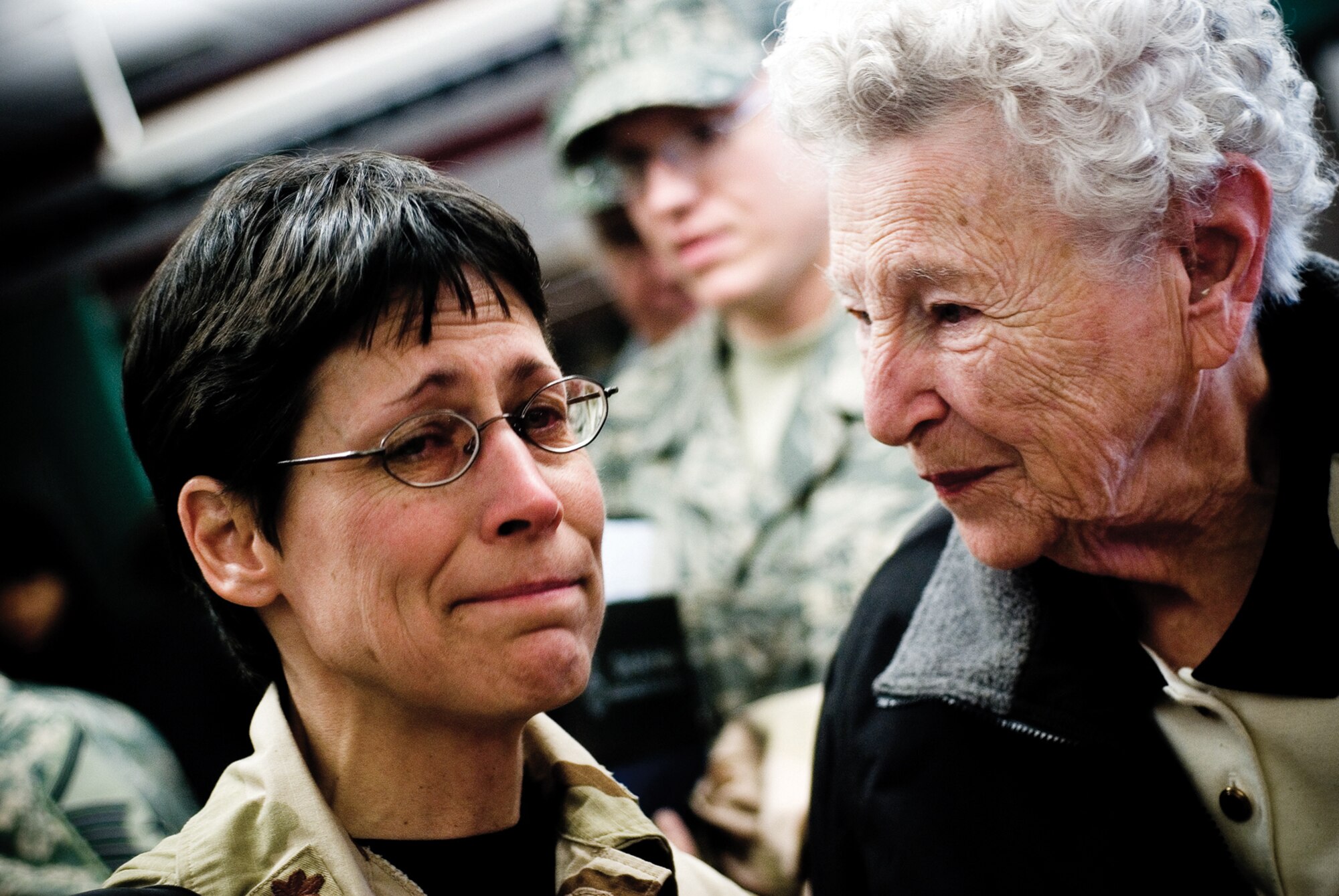 Maj. Deborah C. McCabe,  a 439th Aeromedical Staging Squadron physician?s assistant, holds back a well of tears after saying goodbye to family members before departing for Iraq. (U.S. Air Force photo/Senior Airman Michael Lanza)