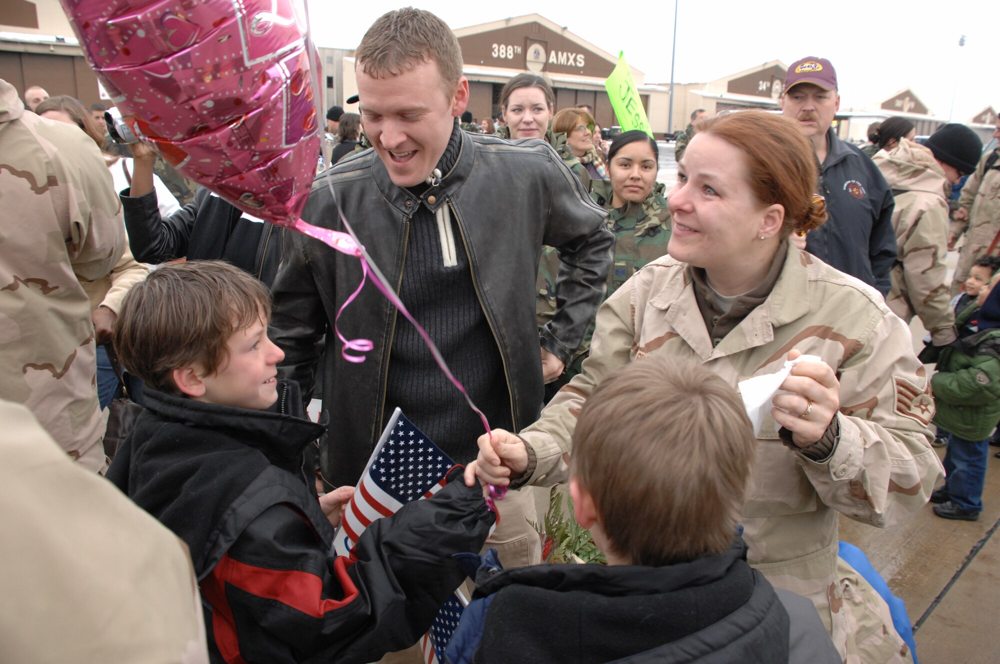 Staff Sgt. Christie Bryden, a 388th Maintenance Group Airman, is welcomed home by her family at the 4th Fighter Squadron's homecoming Jan. 8.  The 4th FS deployed to Balad Air Base, Iraq in August and flew approximately 1,800 missions in support of ground forces in Operation Iraqi Freedom.  (U.S. Air Force photo by Alex Lloyd)