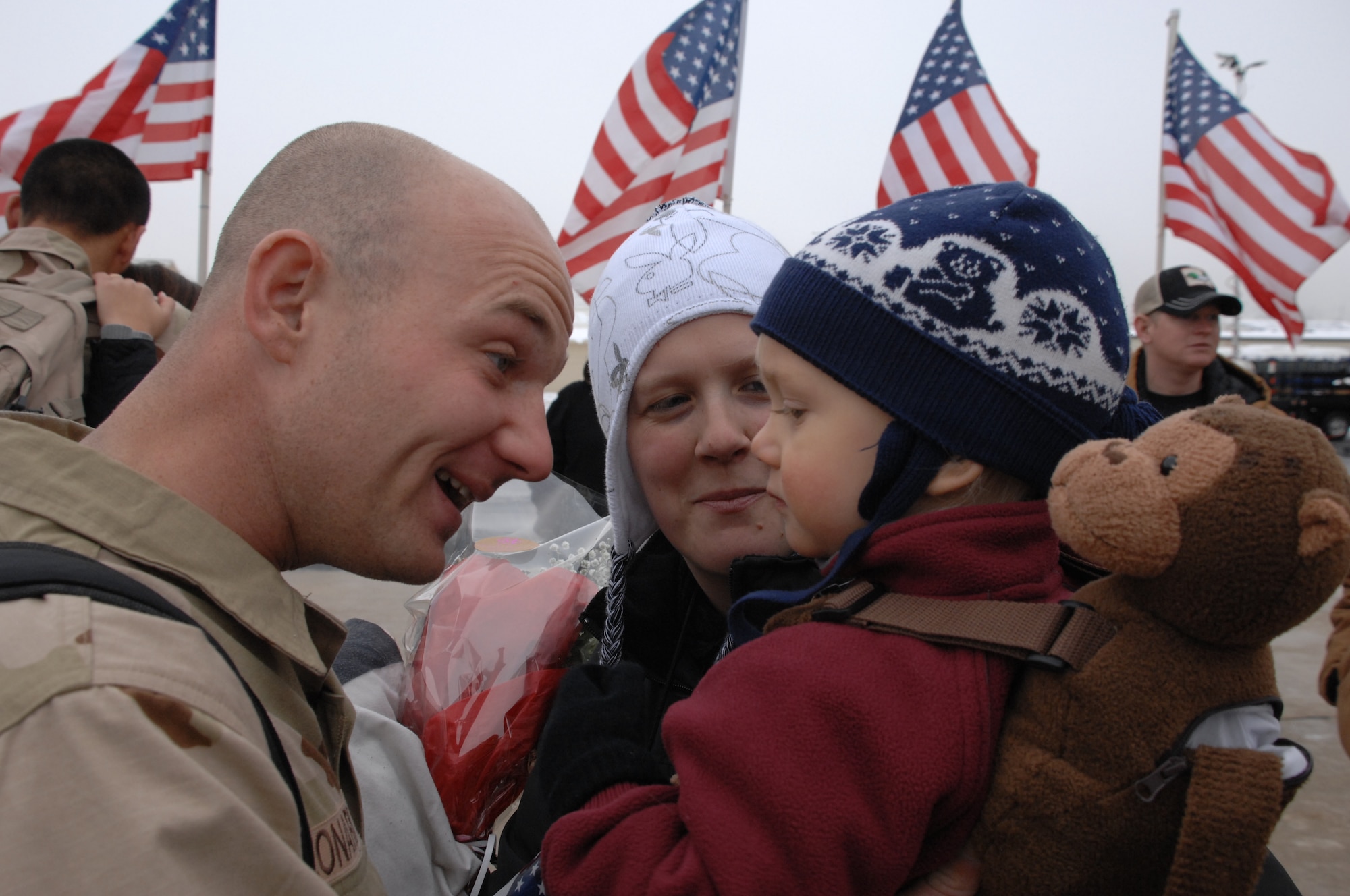 Staff Sgt. Eric Leonhard of the 388th Equipment Maintenance Squadron greets loved ones at the 4th Fighter Squadron homecoming Jan. 8.  The 4th FS deployed to Balad Air Base, Iraq in August and flew approximately 1,800 missions in support of ground forces in Operation Iraqi Freedom.  (U.S. Air Force photo by Alex Lloyd)