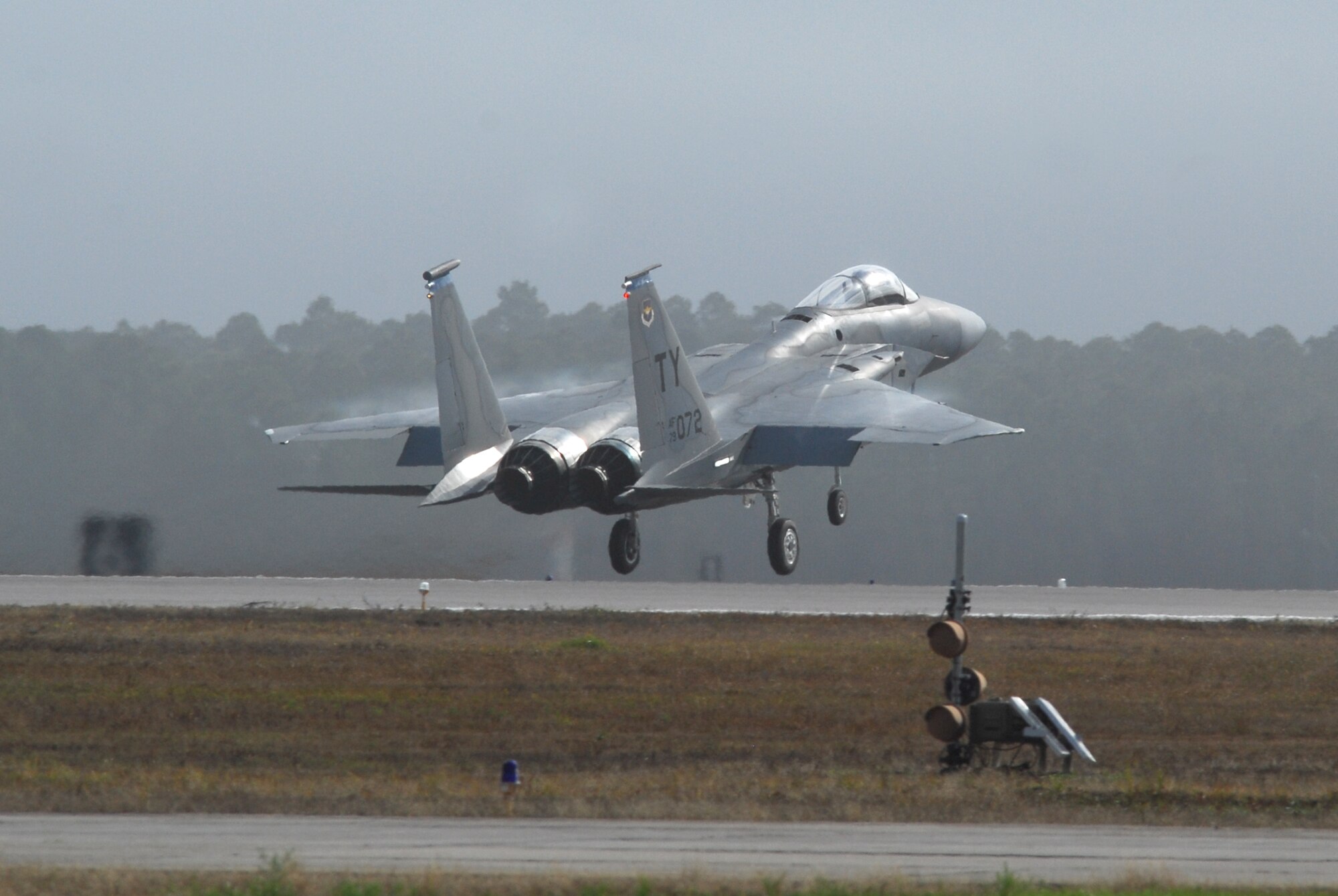 Capt. Dave Christensen, 95th Figther Squadron Flight C commander, takes off in the F-15C/D tail 072 at 10.08a.m. Jan. 9.  This is the first F-15 C/D to take off at Tyndall Air Force Base since the stand down had been given Nov. 3, 2007.  (Photo by Lisa Norman)