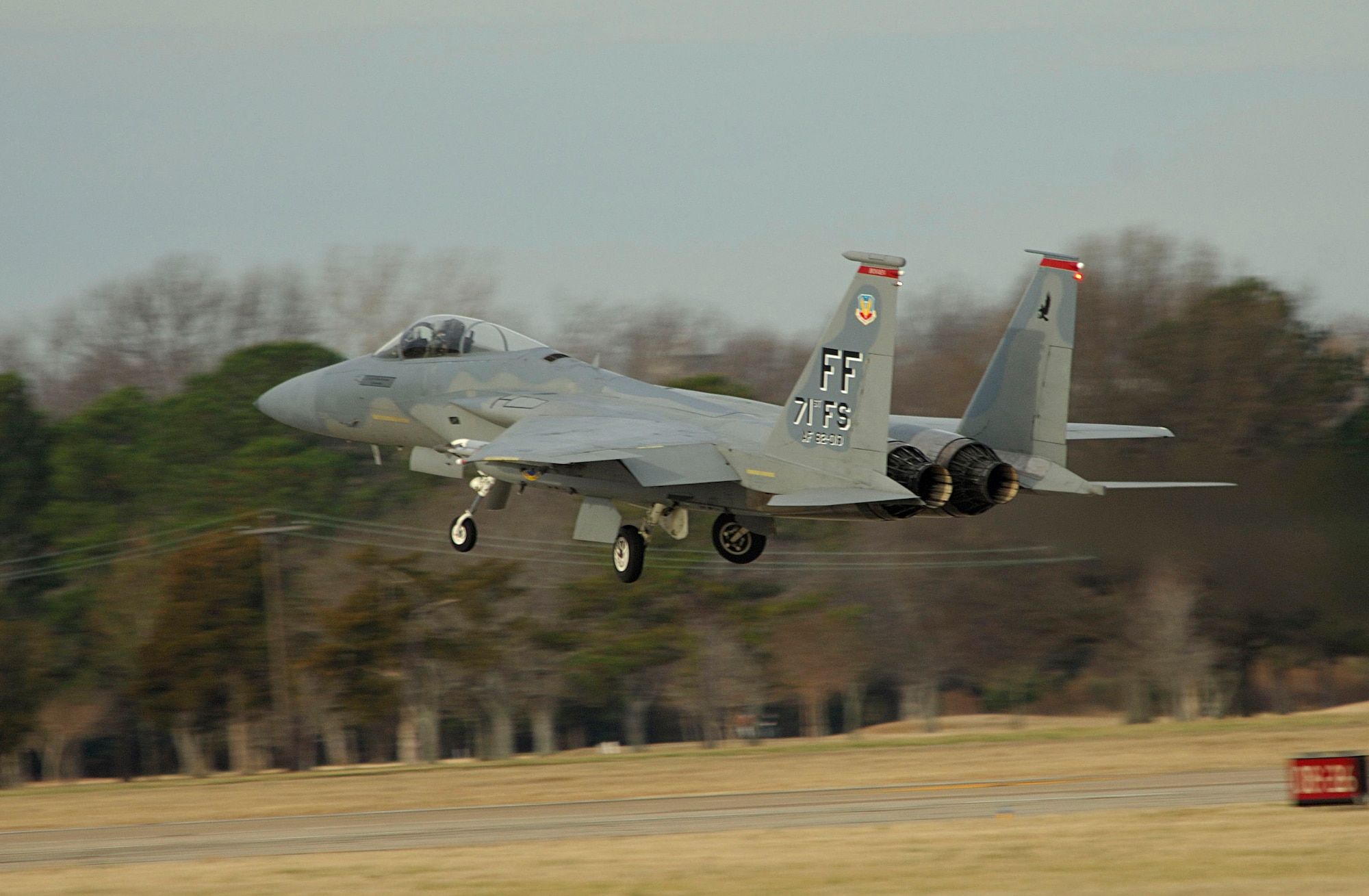 LANGLEY AIR FORCE BASE, Va. -- Lt. Col. Robert Garland, 71st Fighter Squadron commander, takes flight in his F-15 Eagle for a morning sortie Jan. 9. After a month-long stand-down, the 71st FS launched the first of its F-15C fleet Jan. 9 at 9:30 a.m. (U.S. Air Force photo/Staff Sgt. Samuel Rogers)