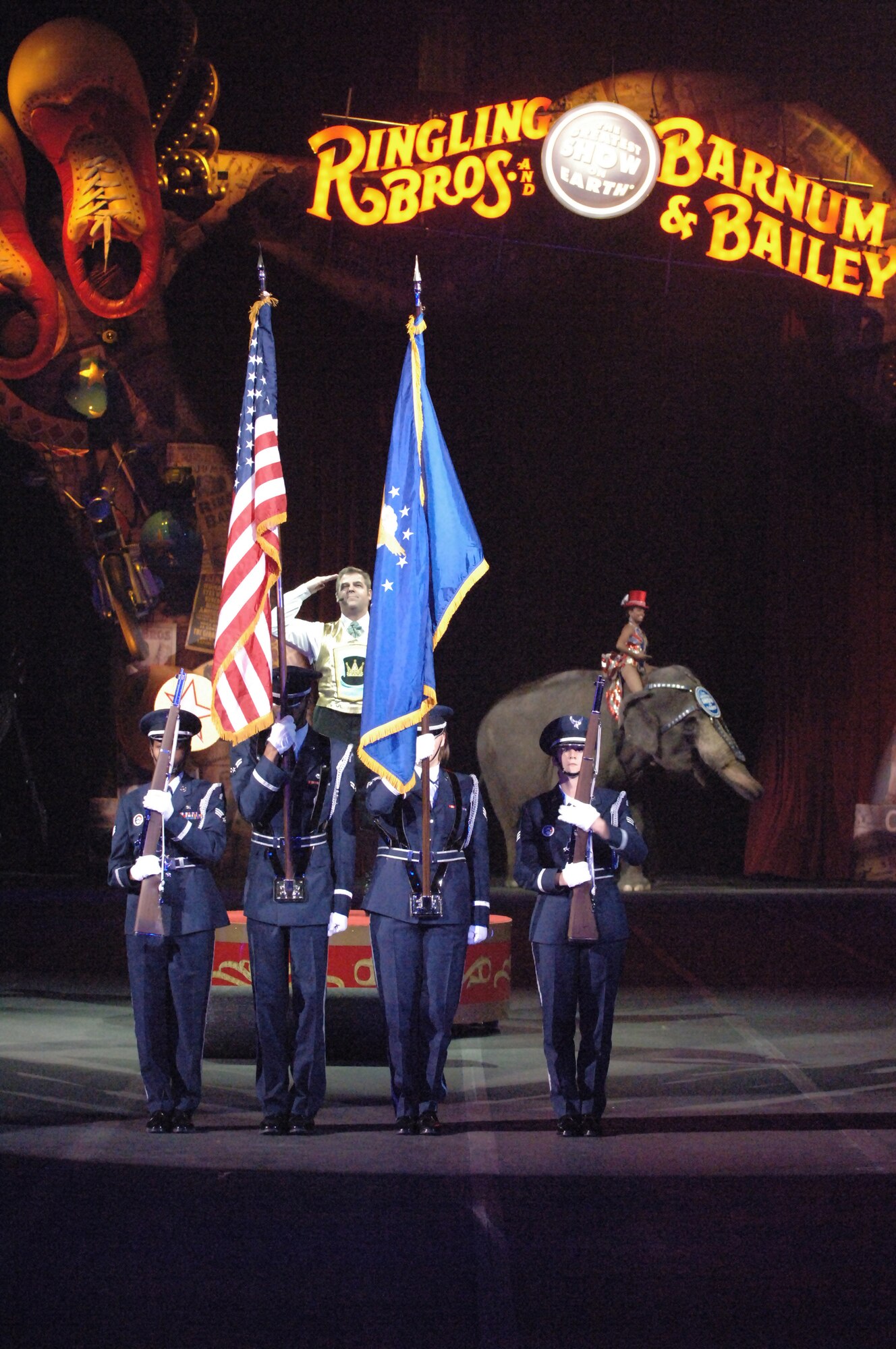 Members of the Macdill AFB Honor Guard present the colors as the Ringmaster Chuck Wagner performs the National Anthem during the Ringling Bros. and Barnum & Bailey Circus at the St. Pete Times Forum in Tampa, Fla, Jan 4.  (U.S. Air Force photo by Staff Sgt. Joseph Swafford, Jr.)(Released)