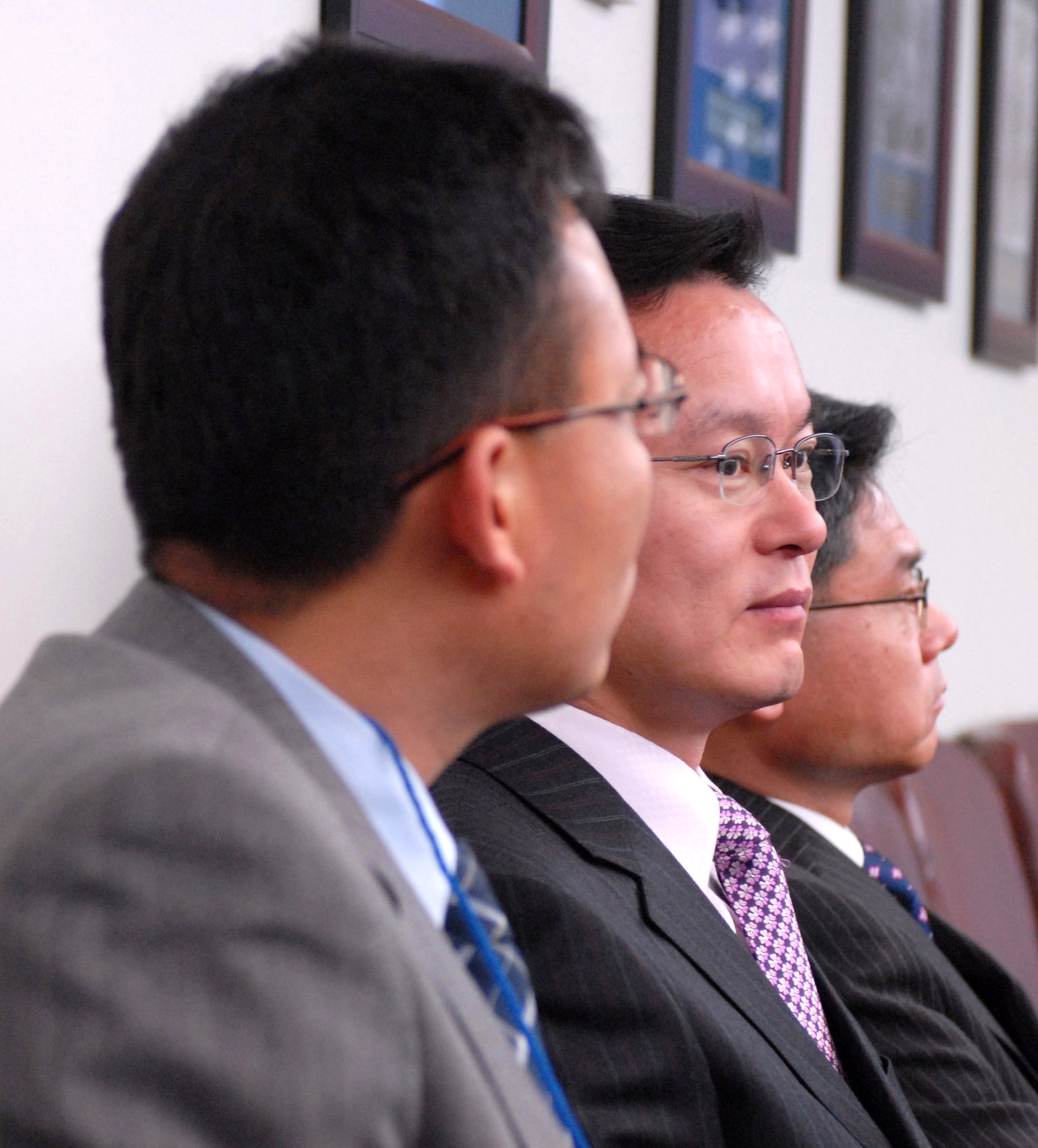 Yi Kil Yong, (from left) Kim Bong Kon and Woo Maeng Yeol listen to a brief on the history of the 7th Air Force Jan. 8 at Osan Air Base, South Korea. Officials from 7th Air Force hosted Gunsan civic leaders in support of the Good Neighbor Program where Kunsan Air Base, South Korea, is educating local civic leaders on the 7th Air Force and 8th Fighter Wing missions while demonstrating how the U.S. Air Force works and trains with South Korean to maintain peace and stability in the region. (U.S. Air Force photo/Senior Airman Steven R. Doty) 
