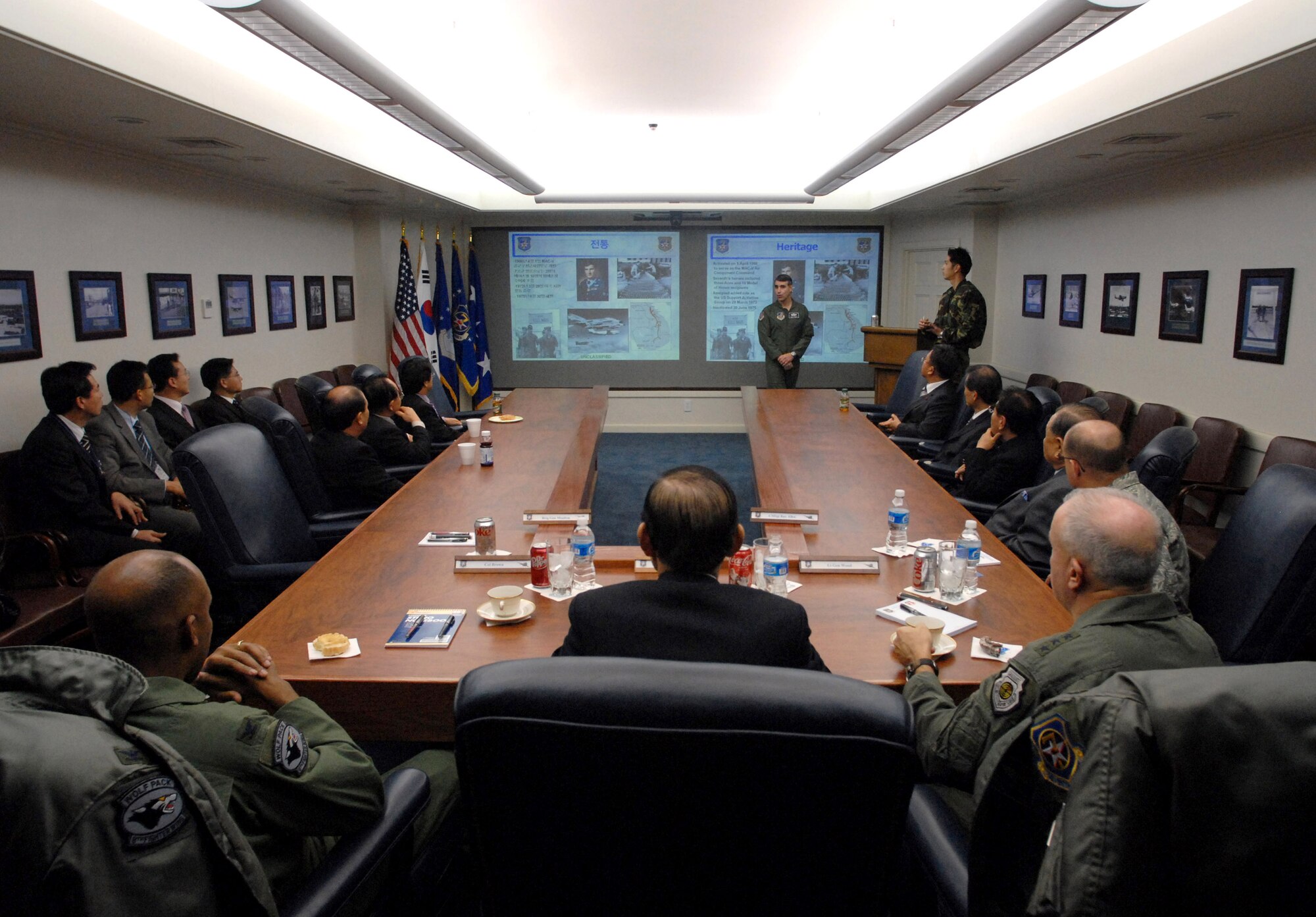 Gunsan Mayor Dong Shin Moon (back center) and other Gunsan civic leaders meet with Lt. Gen. Stephen G. Wood (back left) and Col. CQ Brown (back right) Jan. 8 at Osan Air Base, South Korea. General Wood is the 7th Air Force commander and Colonel Brown is the 8th Fighter Wing commander. Officials from 7th Air Force hosted Gunsan civic leaders in support of the Good Neighbor Program where Kunsan Air Base, South Korea, is educating local civic leaders on the 7th Air Force and 8th Fighter Wing missions while demonstrating how the U.S. Air Force works and trains with South Korean to maintain peace and stability in the region.(U.S. Air Force photo/Senior Airman Steven R. Doty) 
