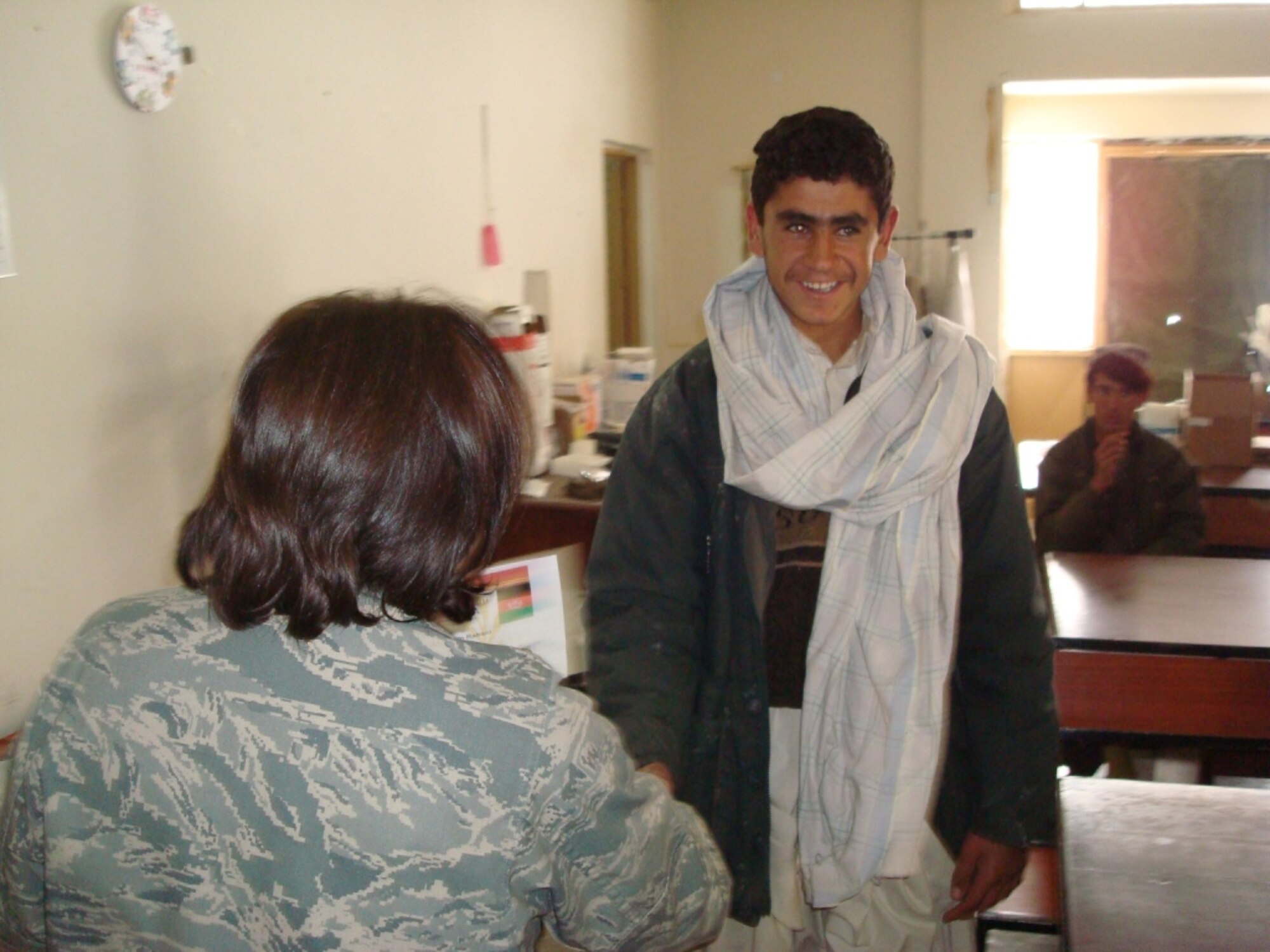 Basir Ahmed graduates from Provincial Reconstruction Team Qalat’s basic Emergency Medical Technician training course here Jan. 8.  The three-month course is similar to a basic first aid class or the military’s self-aid and buddy care training.  (Air Force photo by Capt. Bob Everdeen)