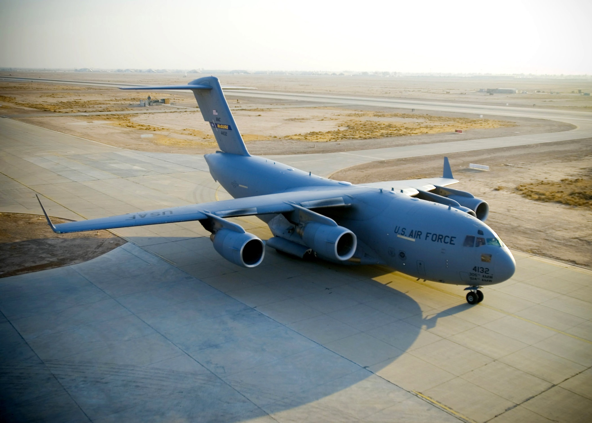 A C-17 Globemaster III taxies to the ramp at Balad Air Base, Iraq. The C-17 performs tactical airlift and airdrop missions, and transports litters and ambulatory patients during aeromedical evacuations in support of operations Enduring Freedom and Iraqi Freedom. (U.S. Air Force photo/Master Sgt. John Nimmo Sr.)