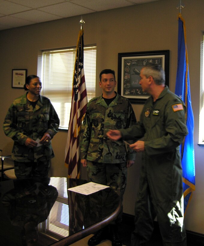 SEYMOUR JOHNSON AIR FORCE BASE, N.C. -- Col. Fritz Linsenmeyer (right) congratulates Master Sgt. Michael Langdon (center) on his promotion, while Senior Master Sgt. Ellen Shaheed looks on.  Sergeant Langdon is in-service recruiter while Sergeant Shaheed is the senior recruiter.  The 916th Air Refueling Wing Recruiting Office is currently seeking appliants from within the wing.  Interested reservists should contact recruiting for more information.           