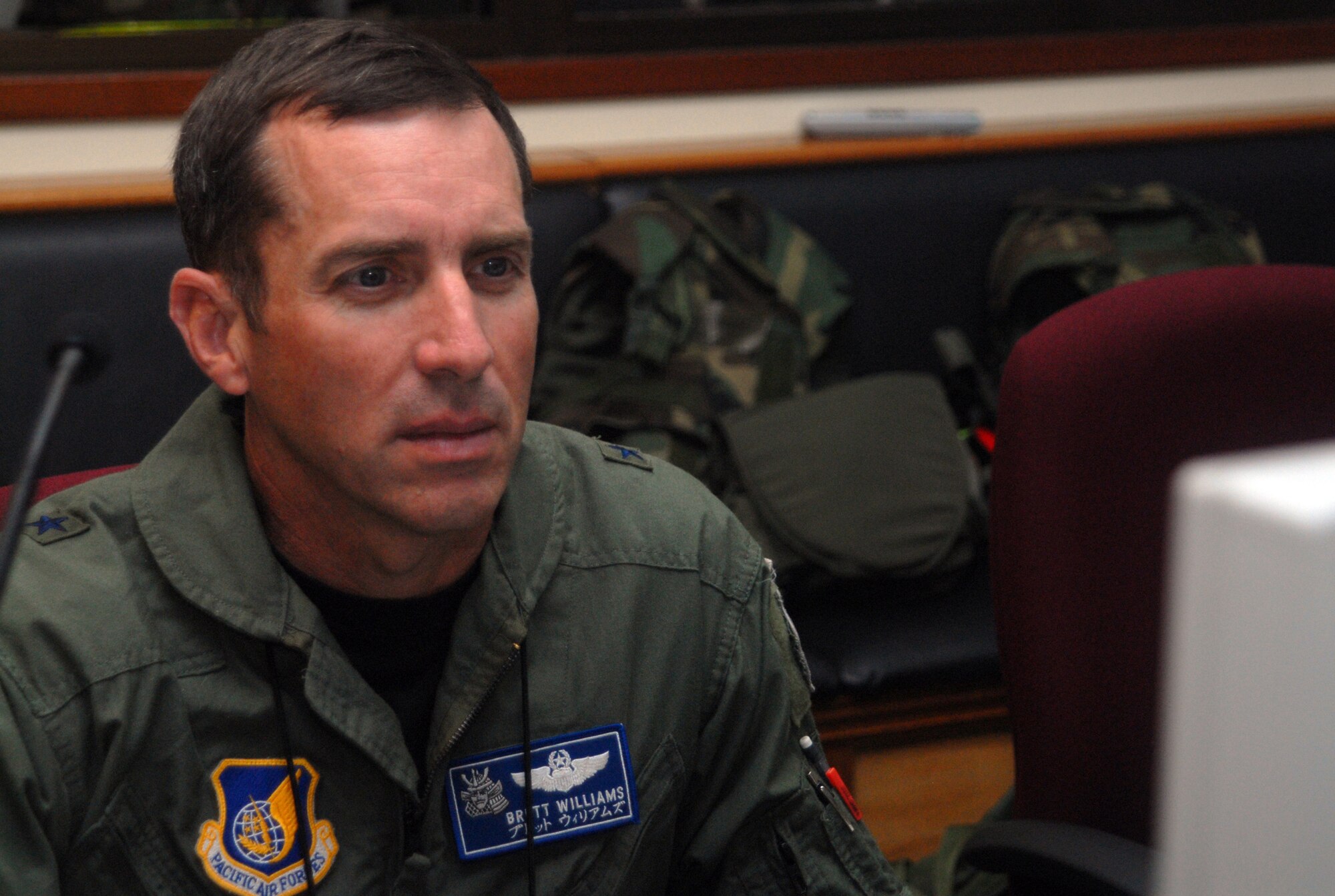 Brig. Gen. Brett T. Williams, 18th Wing commander, reviews exercise information inside the Emergency Operations Center during Local Operational Readiness Exercise Beverly High 08-3 at Kadena Air Base, Japan, Jan. 7, 2007. The 18th Wing exercise from Jan. 7 to 11 tests the wing's ability to respond in contingency situations. (U.S. Air Force photo/Staff Sgt. Christopher Marasky)