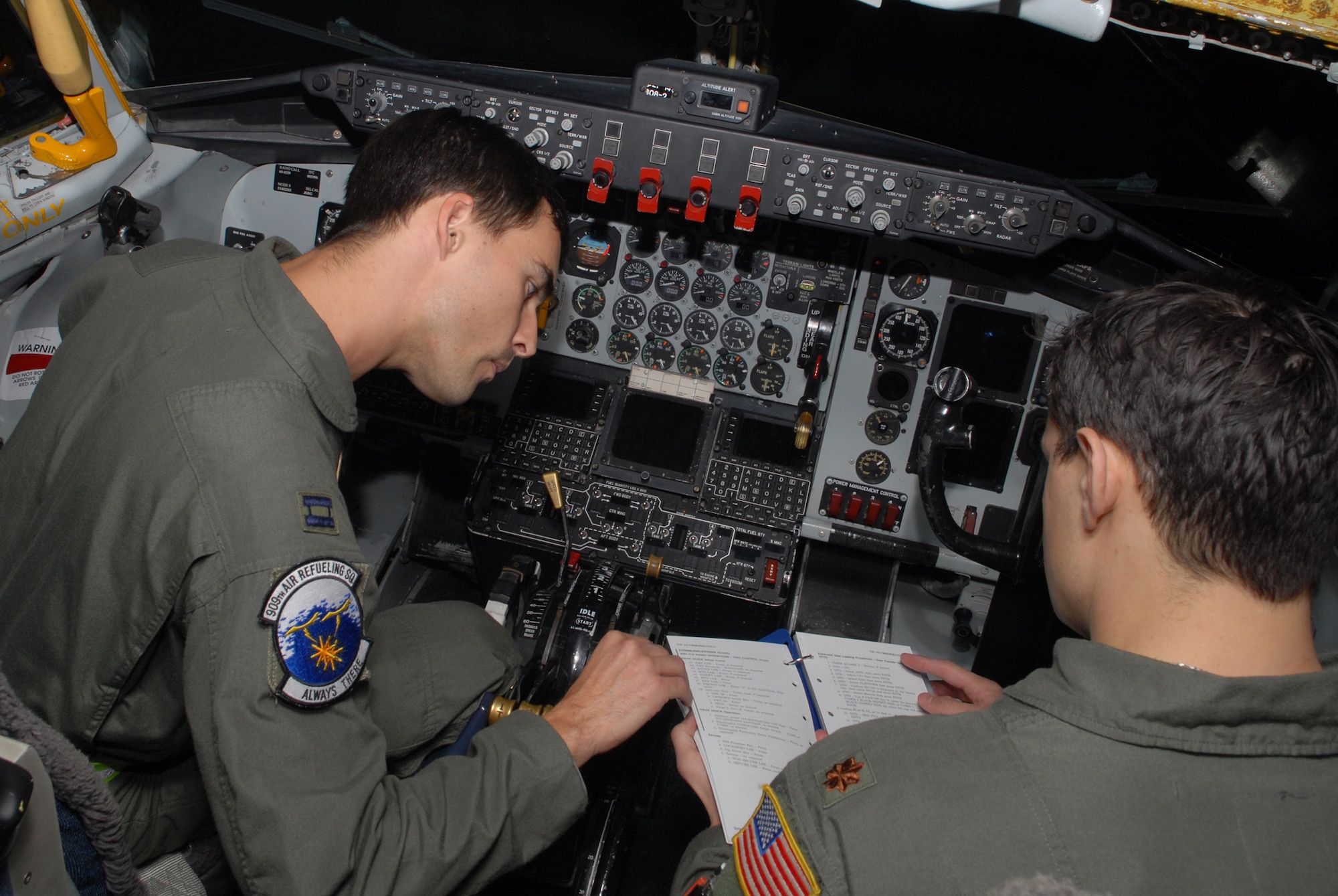 Capt. Denique Asion, and Maj. Michael Kallai, 909th Air Refueling Squadron, go through a KC-135 Stratotanker check list prior to takeoff during a simulated aircrew extraction scenario, during Local Operational Readiness Exercise Beverly High 08-3 at Kadena Air Base, Japan, Jan. 9, 2007. The 18th Wing conducted the exercise from Jan. 7 to 11 to test Airmen's ability to respond in contingency situations. (U.S. Air Force photo/Staff Sgt Chrissy FitzGerald)