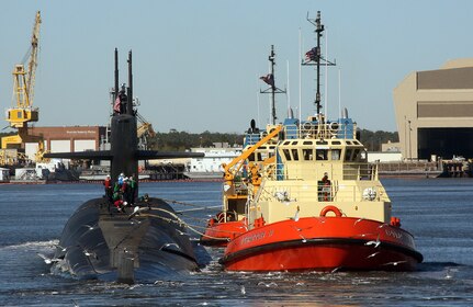 KINGS BAY, Ga. - The ballistic-missile submarine USS Rhode Island (SSBN 740) is escorted by tug boats to her berth at Naval Submarine Base Kings Bay, Ga.