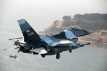 KUNSAN AIR BASE, South Korea -- Captain Joseph Drummond, pilot from the 80th Fighter Squadron, flies a training mission with an F-16 Block 30 over the South Korean peninsula here Jan. 9.  The 80th FS will soon finish upgrading to F-16 Block 40s from Eielson Air Force Base, Alaska under the Common Configuration Implementation Program (CCIP), which increases mission capability and combat readiness by utilizing newer air frames and avionics.  (U.S. Air Force photo / Tech. Sgt. Quinton T. Burris)   