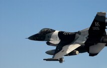 KUNSAN AIR BASE, South Korea -- Captain Joseph Drummond, pilot from the 80th Fighter Squadron, flies a training mission with an F-16 Block 30 over the South Korean peninsula here Jan. 9.  The 80th FS will soon finish upgrading to F-16 Block 40s from Eielson Air Force Base, Alaska under the Common Configuration Implementation Program (CCIP), which increases mission capability and combat readiness by utilizing newer air frames and avionics.  (U.S. Air Force photo / Tech. Sgt. Quinton T. Burris)   