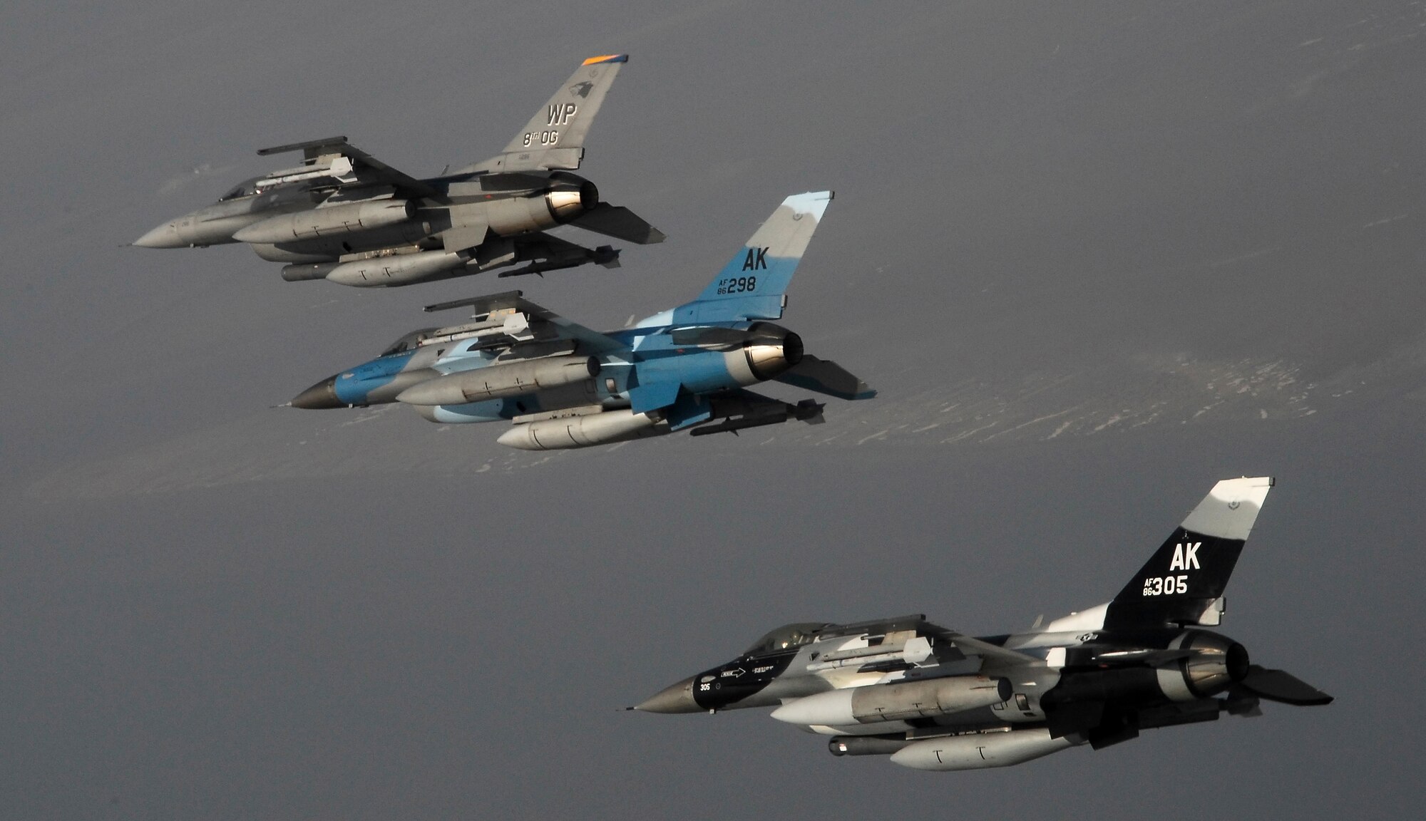 KUNSAN AIR BASE, South Korea -- Pilots from the 80th Fighter Squadron here fly a training mission with F-16 Block 30s over the South Korean peninsula, Jan. 9.  The 80th FS will soon finish upgrading to F-16 Block 40s from Eielson Air Force Base, Alaska under the Common Configuration Implementation Program (CCIP), which increases mission capability and combat readiness by utilizing newer air frames and avionics.  (U.S. Air Force photo / Tech. Sgt. Quinton T. Burris)   