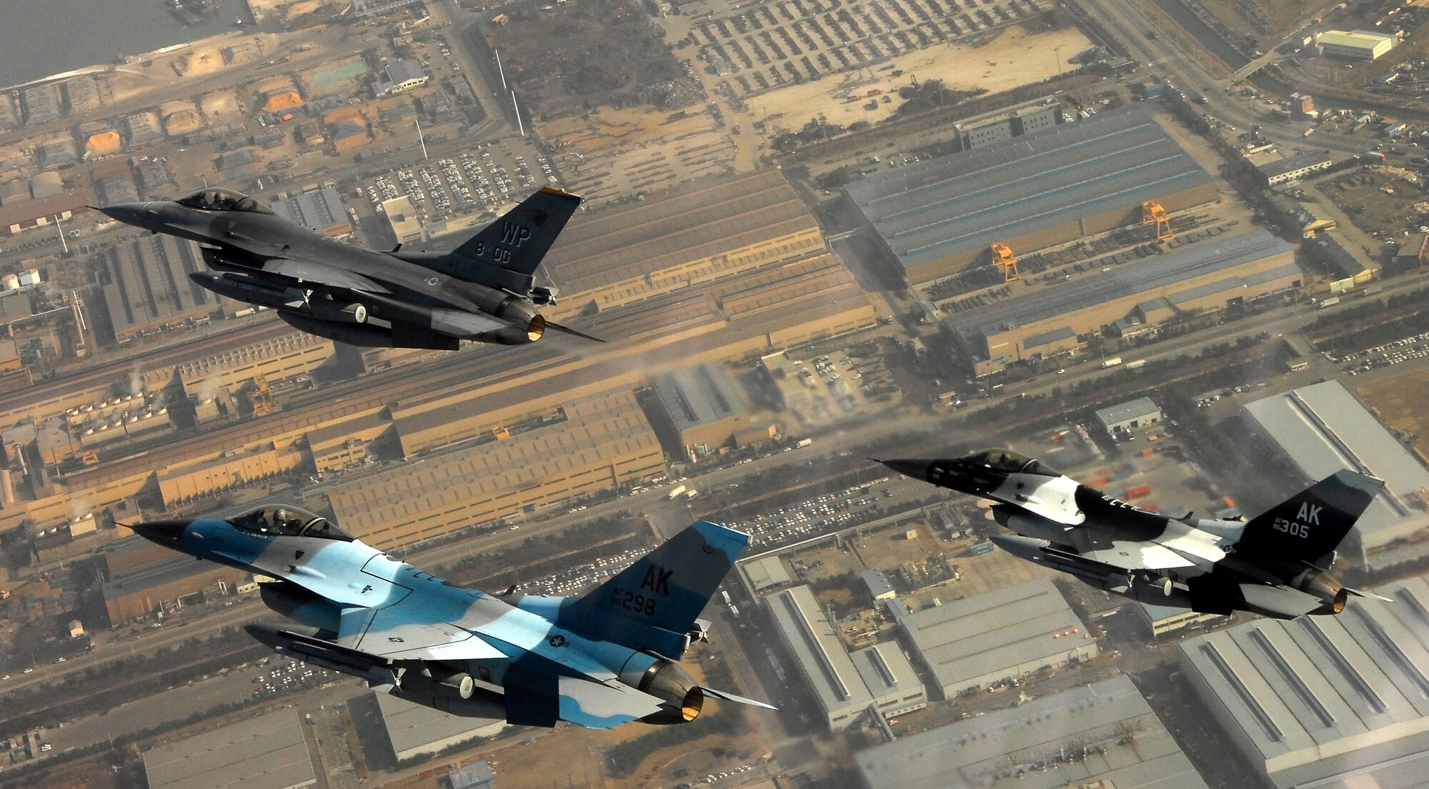 KUNSAN AIR BASE, South Korea -- Pilots from the 80th Fighter Squadron here fly a training mission with F-16 Block 30s over the South Korean peninsula, Jan. 9.  The 80th FS will soon finish upgrading to F-16 Block 40s from Eielson Air Force Base, Alaska under the Common Configuration Implementation Program (CCIP), which increases mission capability and combat readiness by utilizing newer air frames and avionics.  (U.S. Air Force photo / Tech. Sgt. Quinton T. Burris)   