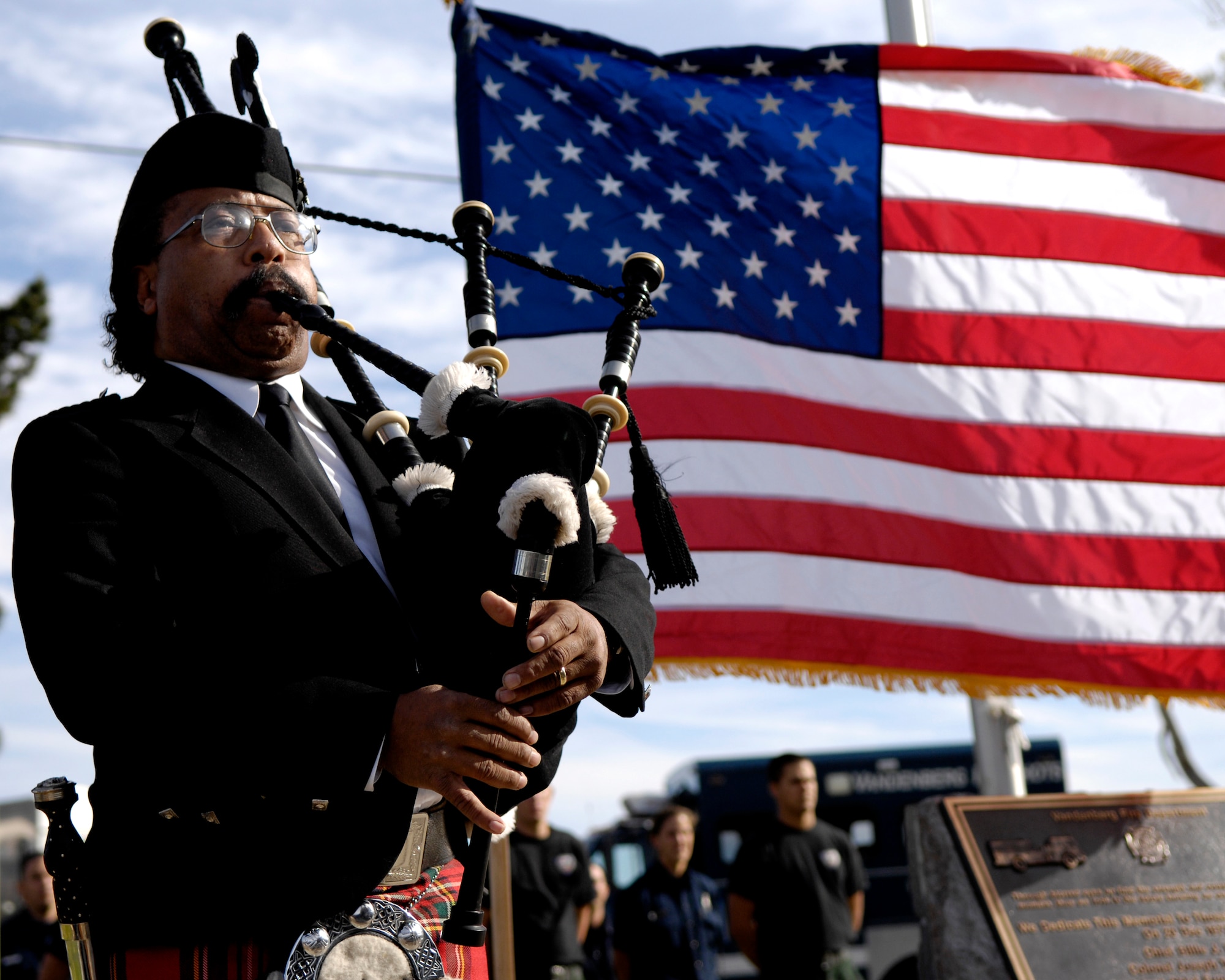 VANDENBERG AIR FORCE BASE, Calif. -- Mr. Ted Jackson, 30th Range Management Squadron, plays "Amazing Grace" on his bag pipes during the 30th Anniversary Memorial Service of the Wildland Fire in front of Fire Station 2 on Dec. 21.  The memorial was held to honor those who made the ultimate sacrifice during the 1977 Wildland Fire here on Vandenberg AFB.  Four Air Force members gave their lives during the fire. (U.S. Air Force photo/Airman 1st Class Jonathan Olds)
