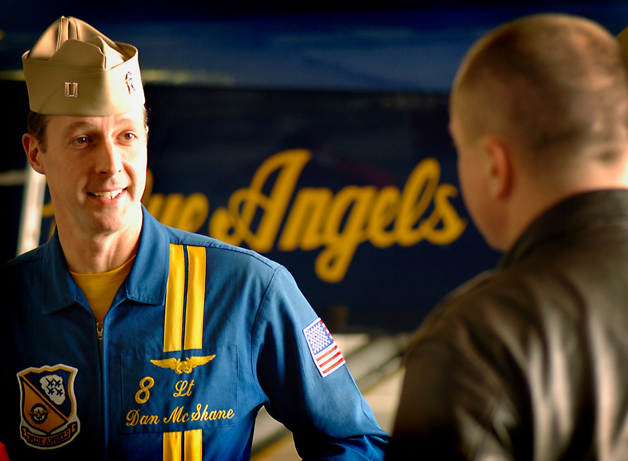 FAIRCHILD AIR FORCE BASE, Wash. – Lt. Dan McShane, Naval officer and pilot of the prestigious Navy Blue Angels, speaks with local Spokane news reporters and Fairchild Airman about the upcoming airshow, Skyfest 2008, on Jan 8. The Blue Angels will be performing at Fairchild Aug. 8-10. (U.S. Air Force photo / Airman 1st Class Joshua Chapman) 