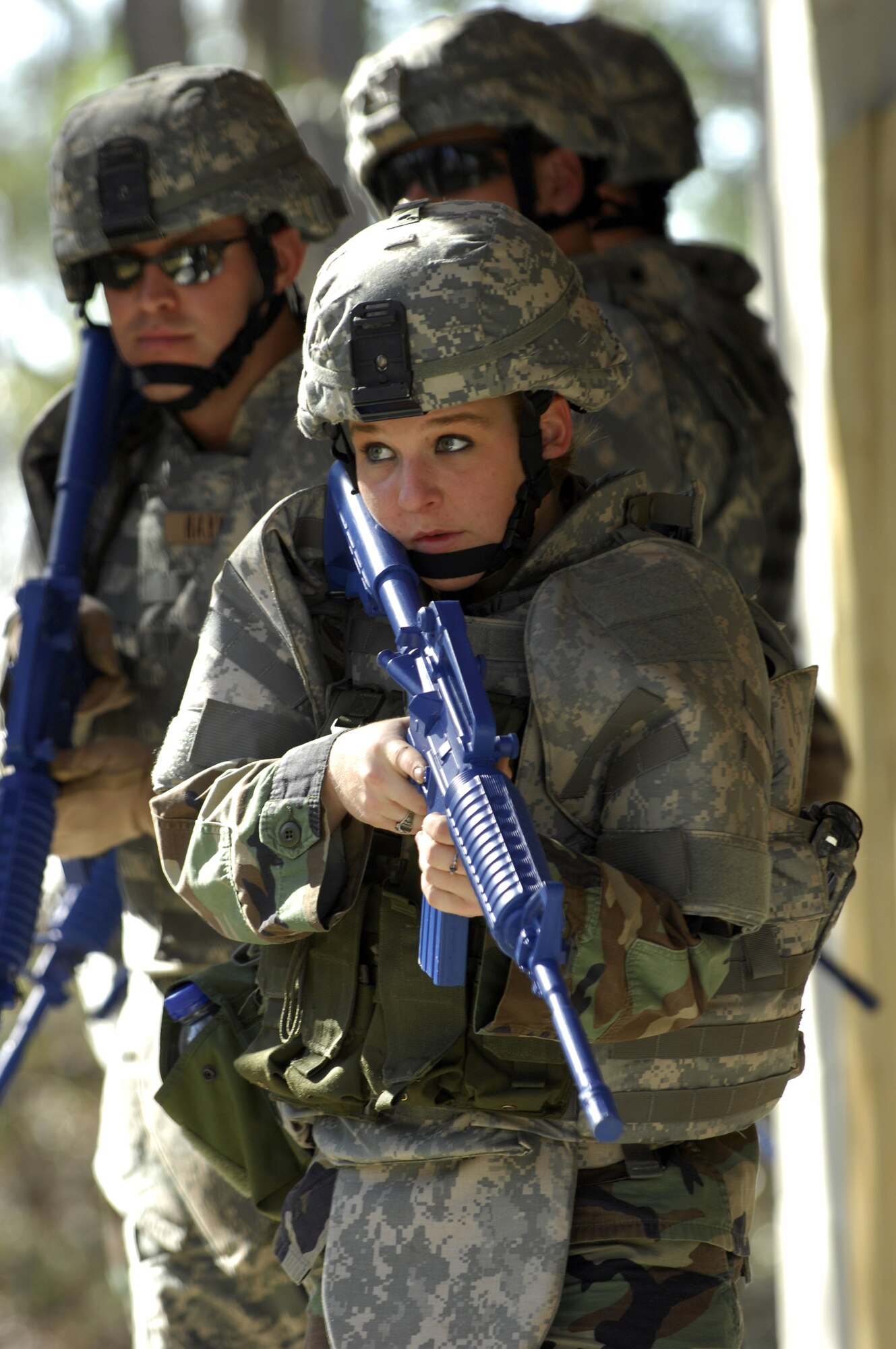 MOODY AIR FORCE BASE, Ga. -- Airman Kimberly Crow, 822nd Security Forces Squadron fire team member, trains with members of her squad at the  820th Security Forces Group's military operations in urban terrain village here Jan. 9. The MOUT is a full scale mock-up of a small village used to train Moody teams in urban combat and civil affairs scenarios.(U.S. Air Force photo by Senior Airman Elizabeth Rissmiller) 
