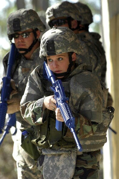 MOODY AIR FORCE BASE, Ga. -- Airman Kimberly Crow, 822nd Security Forces Squadron fire team member, trains with members of her squad at the  820th Security Forces Group's military operations in urban terrain village here Jan. 9. The MOUT is a full scale mock-up of a small village used to train Moody teams in urban combat and civil affairs scenarios.(U.S. Air Force photo by Senior Airman Elizabeth Rissmiller) 
