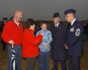 Chief Master Sgt. Dwayne Hopkins, recently retired command chief of the 37th Training Wing, meets with fellow South Carolinians John, Deborah, Aaron and Airman Brad Burnett following a basic military training graduation ceremony. (USAF photo by Alan Boedeker)                                