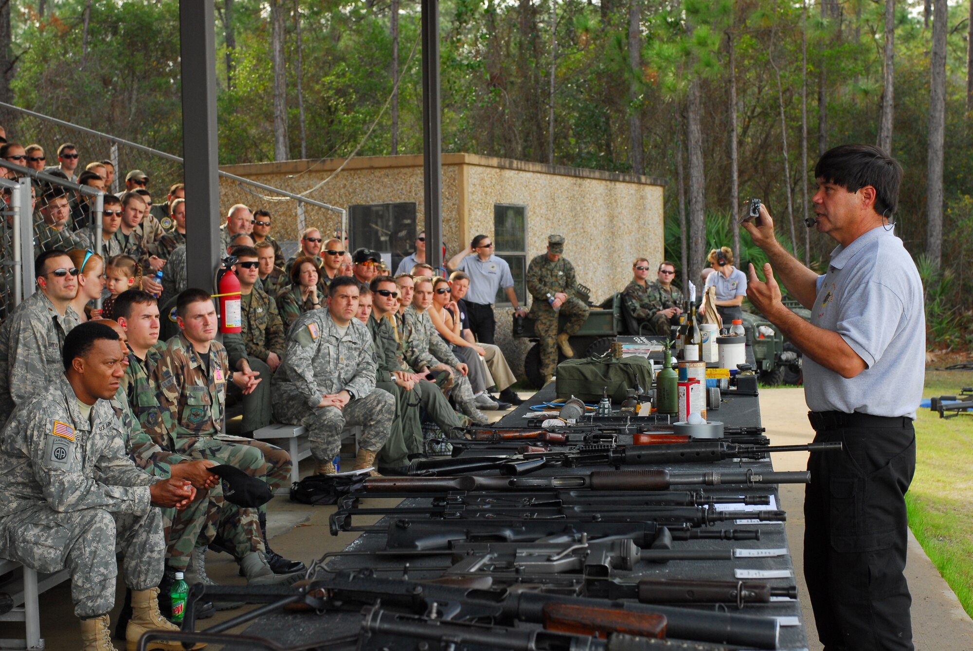 James Wilson, U.S. Air Force Special Operations School, explains explosives and improvised explosive devices used by terrorists in a demonstration Jan. 9 on the Dynamics of International Terrorism range at Hurlburt Field. The demonstration shows students from the DIT course the capabilities of weapons primarily used by terrorist groups. Students from all branches of the U.S. military participate in the course. (U.S. Air Force photo/Airman 1st Class Jason Epley)
