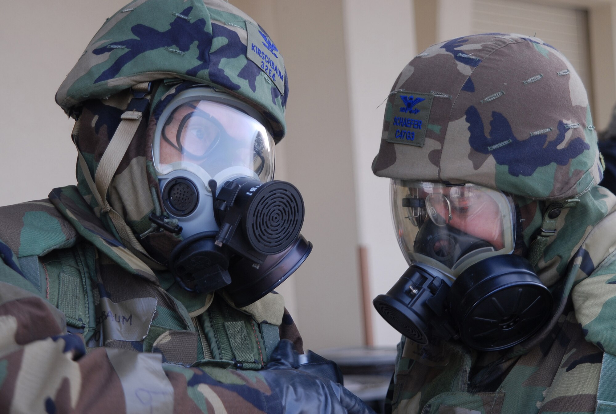 Col. Max Kirschbaum, 18th Mission Support Group commander, talks to Col. Frederick Schaefer, 18th Medical Group commander, after evacuating the 18th Wing Command Post following a simulated missile attack during Local Operational Readiness Exercise Beverly High 08-3 at Kadena Air Base, Japan, Jan. 10, 2007. The 18th Wing conducted the exercise from Jan. 7 to 11 to test the wing's ability to respond in contingency situations.   (U.S. Air Force photo/Tech. Sgt. Dave DeRemer) 