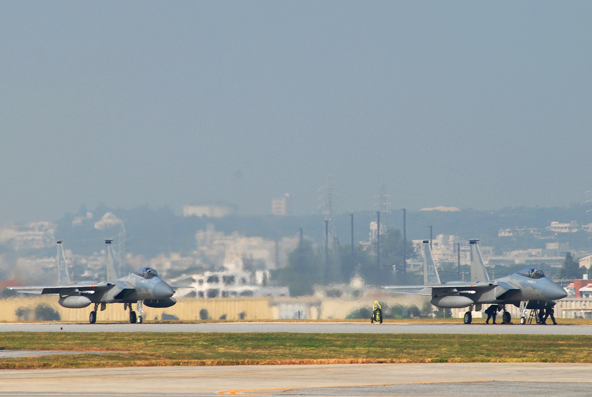 Two Kadena F-15C Eagles go through final pre-flight inspections during Local Operational Readiness Exercise Beverly High 08-3 at Kadena Air Base, Japan, Jan. 10, 2007. The 18th Wing conducted the exercise from Jan. 7 to 11 to test the wing's ability to respond in contingency situations. 
(U.S. Air Force photo/Tech Sgt. Dave DeRemer) 