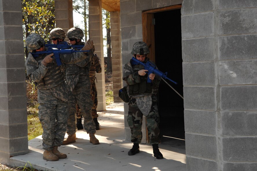 MOODY AIR FORCE BASE, Ga. – Members of the 822nd Security Forces Squadron train on methods used to clear the outside of a building at the 820th Security Forces Group military operations in urban terrain village here Jan 9.  The military tactics the trainees are using are the same ones used during real-world missions in a deployed environment. (U.S. Air Force photo by Senior Airman Angelita Lawrence)