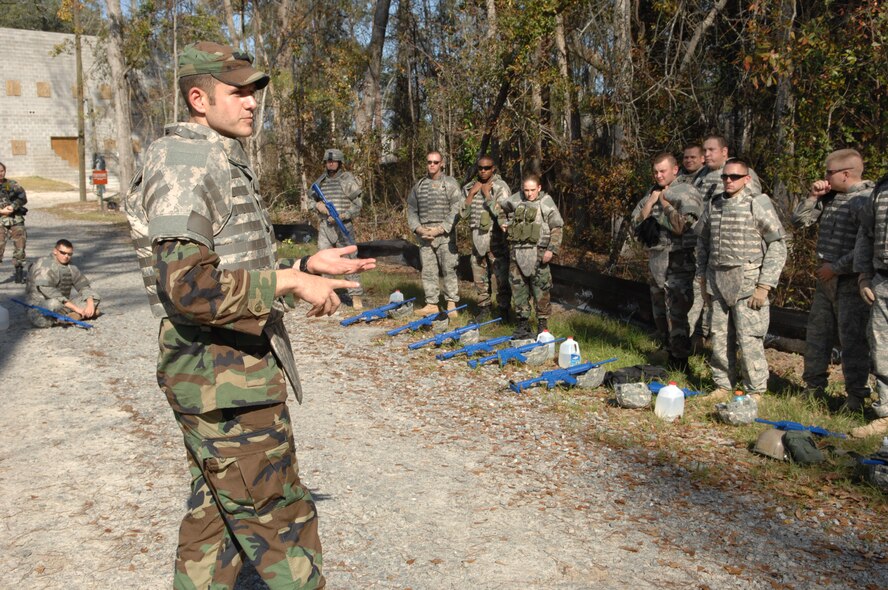 MOODY AIR FORCE BASE, Ga. – Staff Sgt. John Farr, 822nd Security Forces Squadron squad leader, briefs military tactics at the 820th Security Forces Group military operations in urban terrain village here Jan 9.  The training received here at the 820th SFG MOUT prepares Airmen for urban warfare through realistic simulations. (U.S. Air Force photo by Senior Airman Angelita Lawrence)