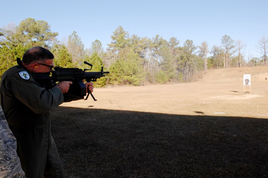 MOODY AIR FORCE BASE, Ga. – Lt Gen. Gary North, 9th Air Force commander, shoots an M249 Assault Rifle during his visit with the 820th Security Forces Group Jan 7.  General North visited the 23rd WG to get an overview of Moody's mission as well as future plans. (U.S. Air Force photo by Senior Airman Angelita Lawrence)