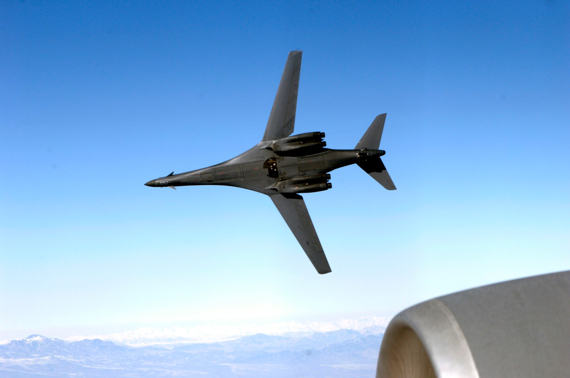 A B-1B Lancer from the 9th Expeditionary Bomb Squadron pulls away from a KC-135 Stratotanker from the 22nd Expeditionary Air Refueling Squadron at Manas Air Base, Kyrgyzstan, after receiving fuel over Afghanistan. Two B-1Bs hit reported al-Qaida safe havens Jan. 10 in Arab Jabour, Iraq. (U.S. Air Force photo/Staff Sgt. Angelique Perez)