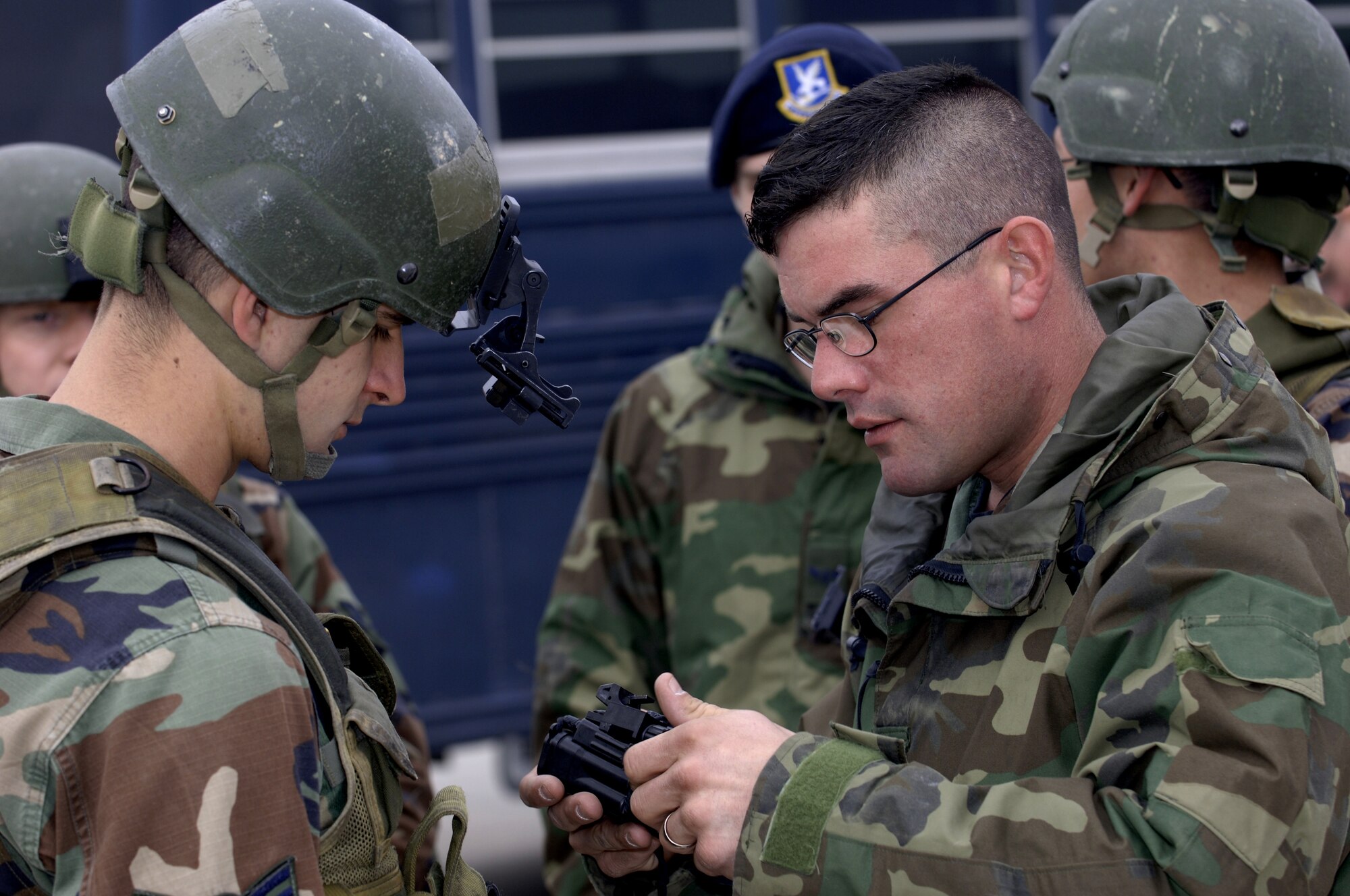 Staff Sgt. Christopher Summers, 39th Security Forces Squadron trainer, right, shows Airman 1st Class Adam Wilson how to properly mount night vision goggles to a Rhino mount during training, Jan. 7. The 39 SFS trains more Airmen, including those on temporary duty, than any other U.S. Air Forces in Europe base. (U.S. Air Force photo by Airman 1st Class Nathan Lipscomb)