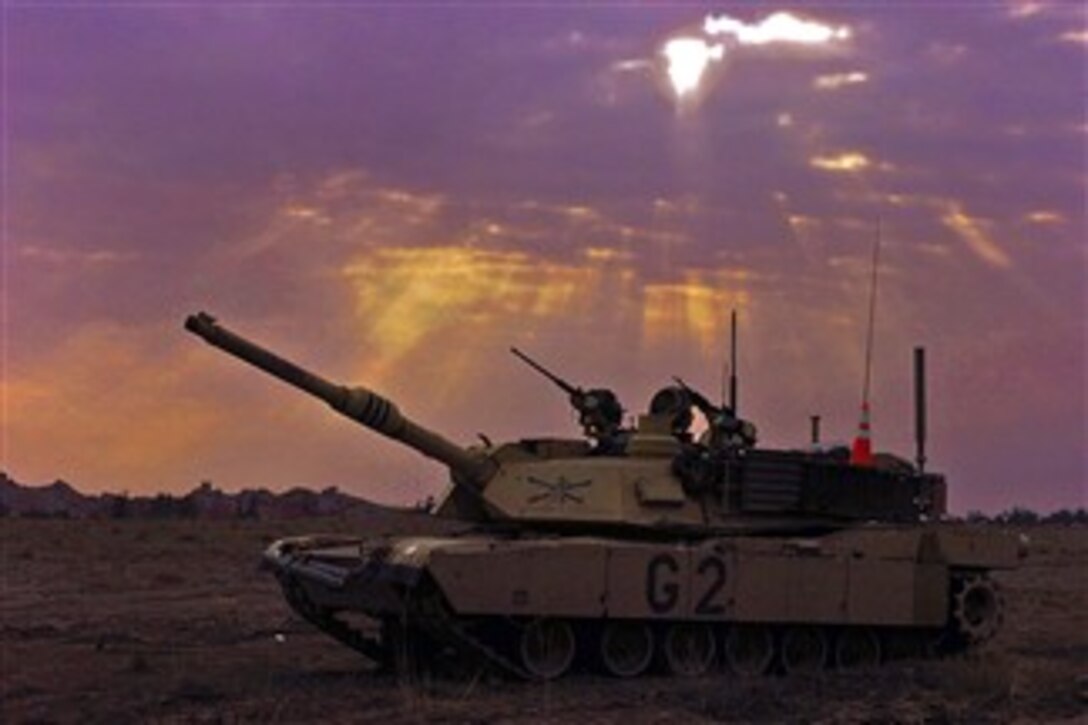 An M1A2 SEP V2 Abrams Tank waits its turn to head toward an objective in support of Operation Raider Harvest near Mansuriyah al Jabal, Iraq, Jan. 9, 2008. 