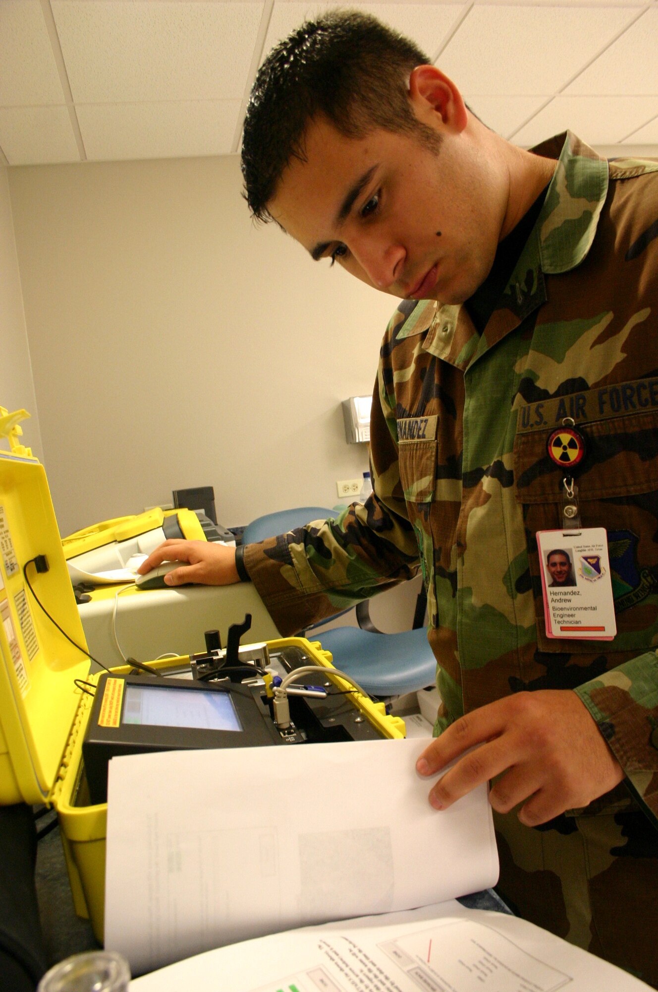LAUGHLIN AIR FORCE BASE, Texas – Senior Airman Andrew Hernandez, bioenvironmental engineer, checks the Hazardous Material Machine during a routine check of their equipment recently. A team of  four bioenvironmental engineers dominated in a recent AETC Chemical, Biological, Radiological and Nuclear challenge, and moved on the compete at Air Force level. (U.S. Air Force photo by Airman 1st Class Sara Csurilla) 