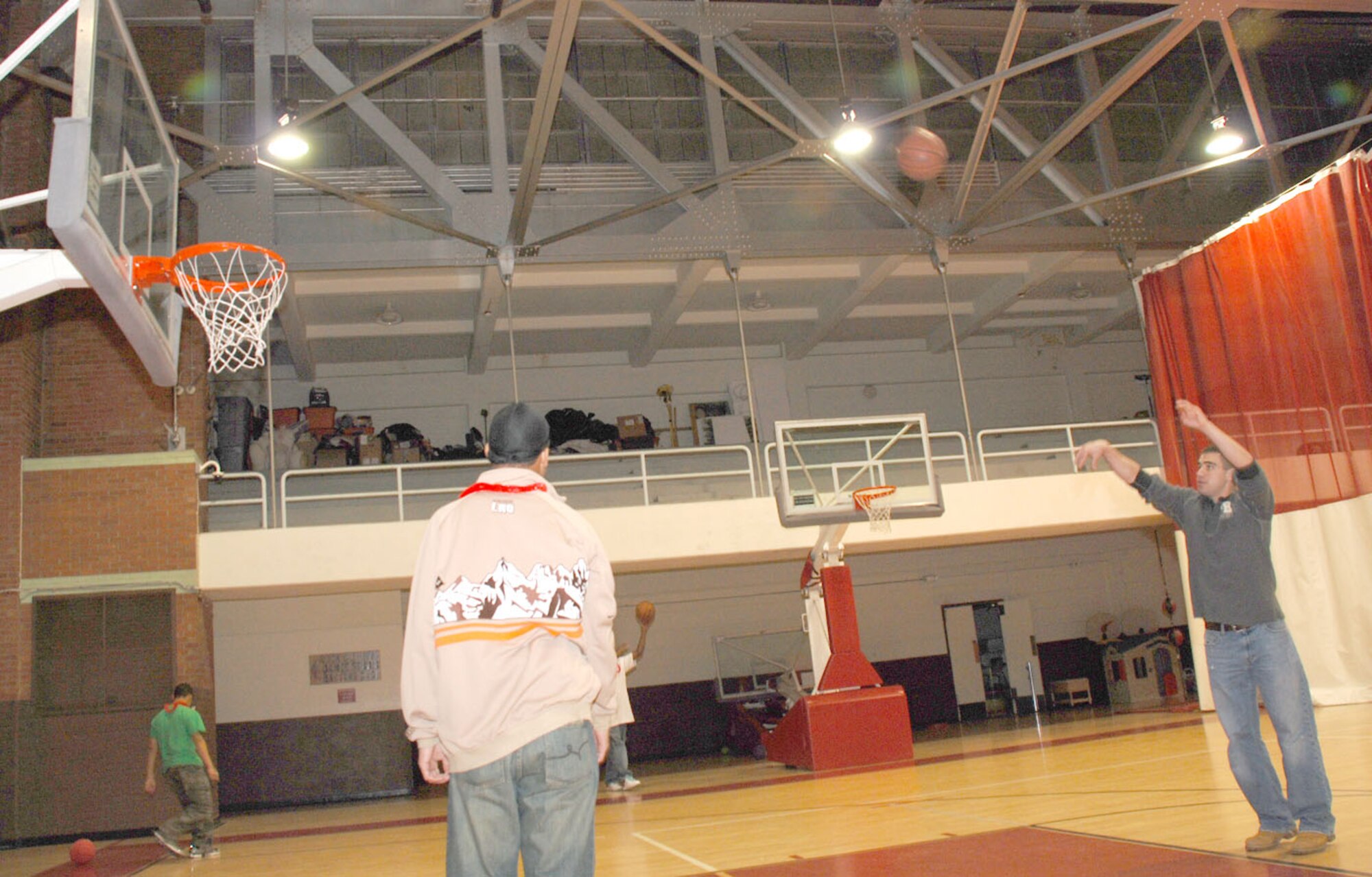 Senior Airman Randall Flatt, 90th Force Support Squadron, shoots a free-throw during the Airman party at the community center. The Airmen played basketball during a break between activities.