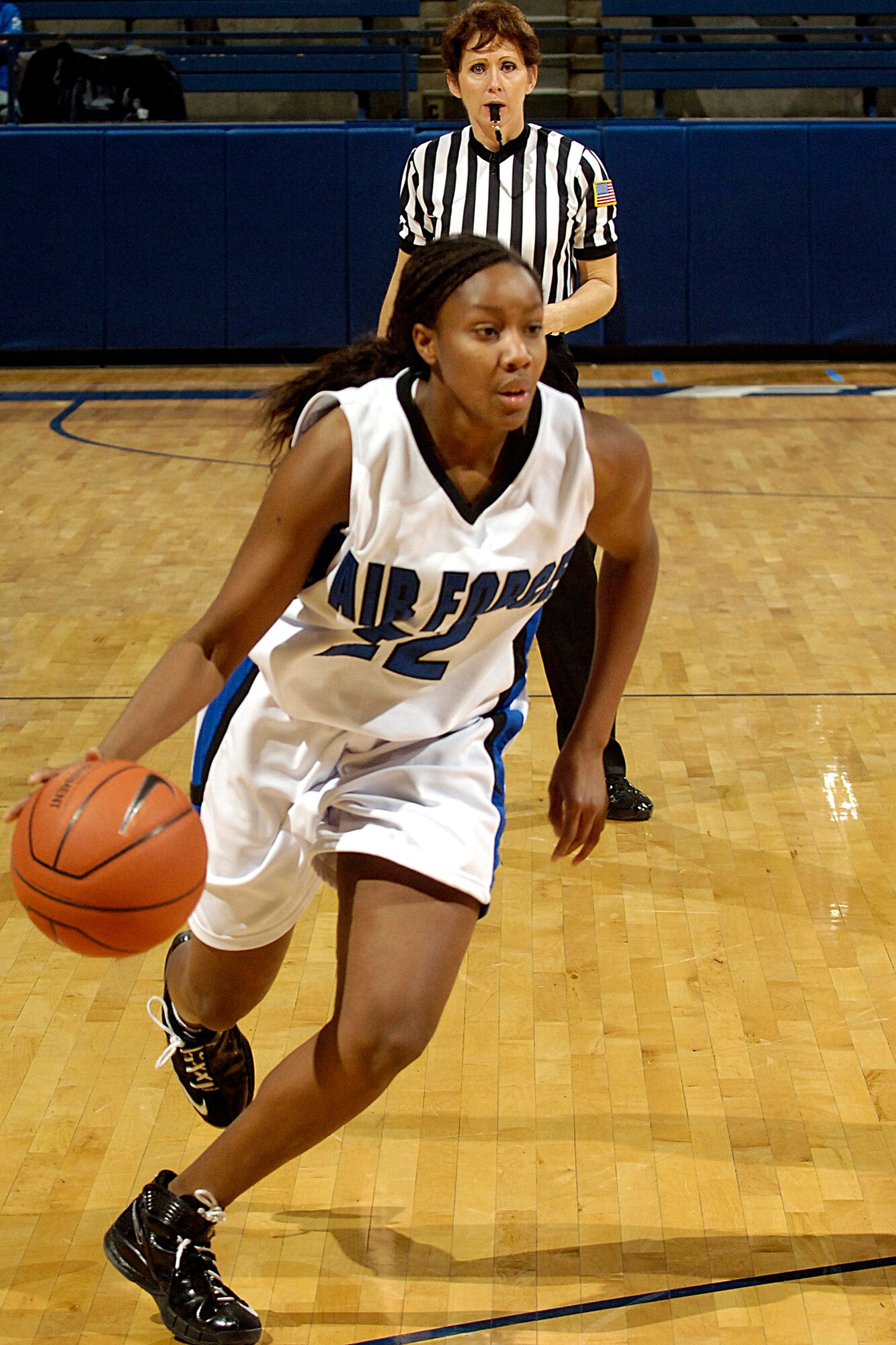 U.S. Air Force Academy Falcon senior guard Jamie Davis drives toward the basket during the 60-50 loss against Utah Jan. 9 in Clune Arena at Colorado Springs, Colo. (U.S. Air Force photo/Dave Ahlschwede) 

