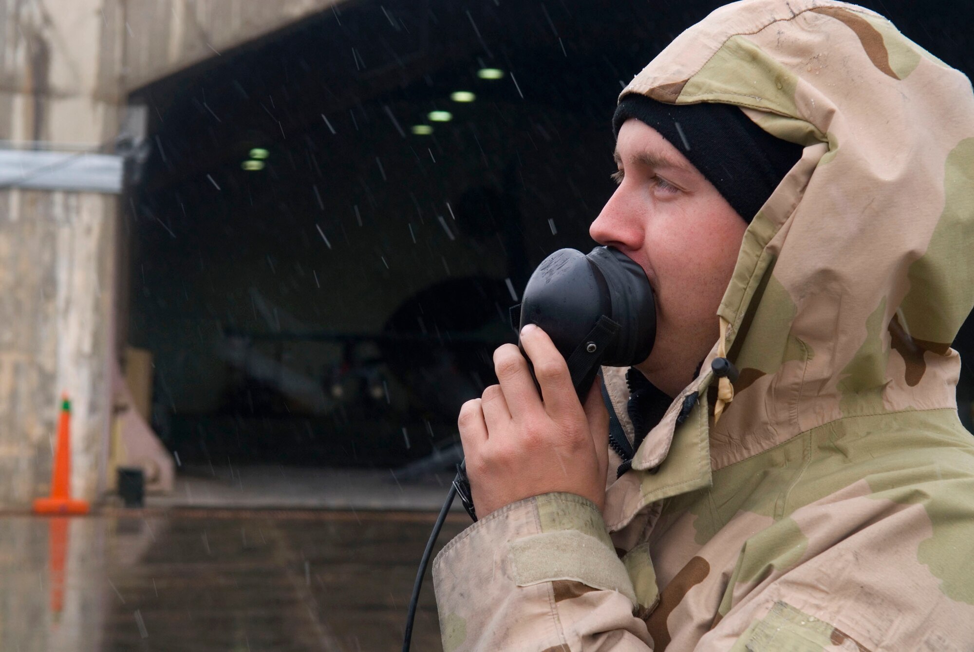 Staff Sgt. Jeremy Crombie speaks into a radio headset to check the status of avionics operations Jan. 11 at Balad Air Base, Iraq. The avionics system gives a pilot the capability to use the Joint Direct Attack Munitions on the F-16 Fighting Falcon. Sergeant Crombie is a 332nd Expeditionary Aircraft Maintenance Unit avionics technician deployed from Spangdahlem Air Base, Germany. (U.S. Air Force photo/Staff Sgt. Joshua Garcia) 
