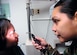 Staff Sgt. Vaigalipa Ripine, right a 79th Medical Surgical Squadron ophthamologist technician, checks the eye dilation of Master Sgt. Kimberley J. Bentley. Sergeant Bentley is a 579th Aerospace Medicine Squadron Public Health NCOIC. (US Air Force/Bobby Jones)