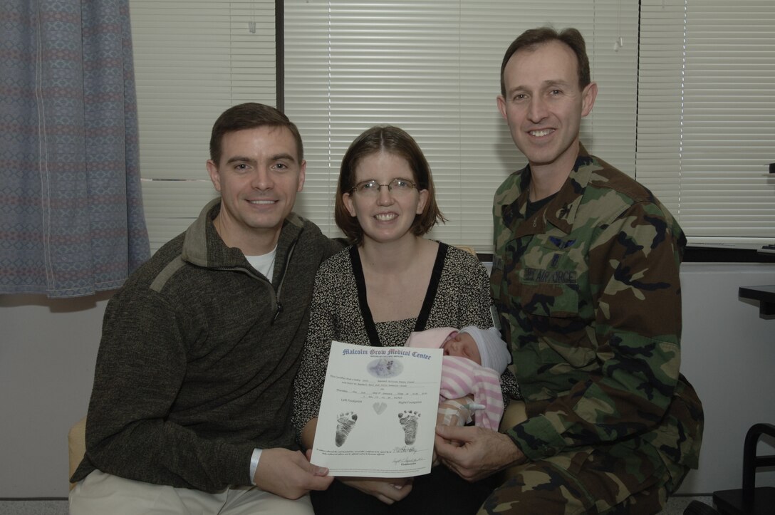 Tech. Sgt. Randall Creed, Joint Staff Physical Security NCO, and wife Julie and their newborn daughter Gillian Renee pose for a photo with Col. August C. Pasquale III, 79th Surgical Operations Squadron commander. Gillian was born Jan. 3 weighing 7-pounds 5-ounces.
(US Air Force/SrA Melissa Stonecipher)