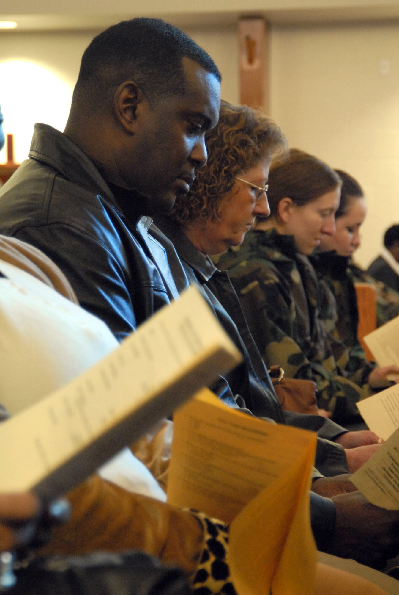 Kenneth Green, 95th Mission Support and Services Squadron civilian personnel data manager, participates in the Dr. Martin Luther King Jr. observance at the Chapel 1 Sanctuary on Jan. 10. (Photo by Senior Airman Julius Delos Reyes)