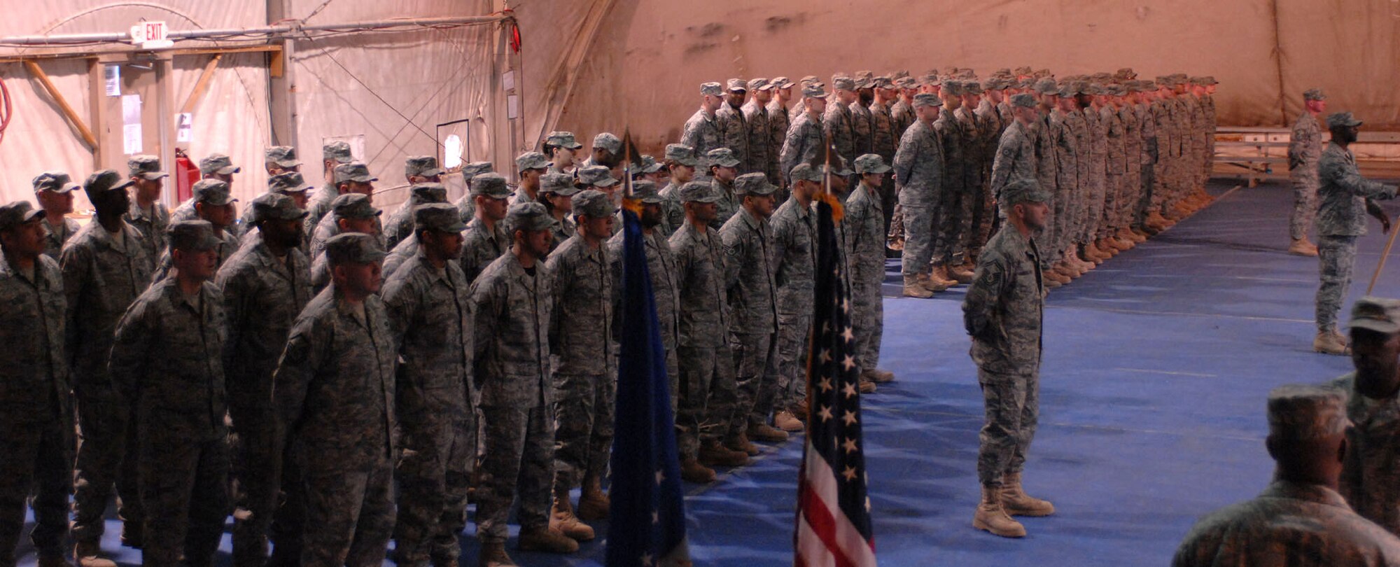 Members of the 755th Expeditionary Security Forces Squadron stand together for the last time Jan. 11 at Bagram Air Base, Afghanistan. The squadron, originally formed in May 2006 in response to a Army request for support of its detainee operations mission, was inactivated during a formal ceremony Jan. 11 here. (U.S. Air Force photo/Staff Sgt. Mike Andriacco) 
