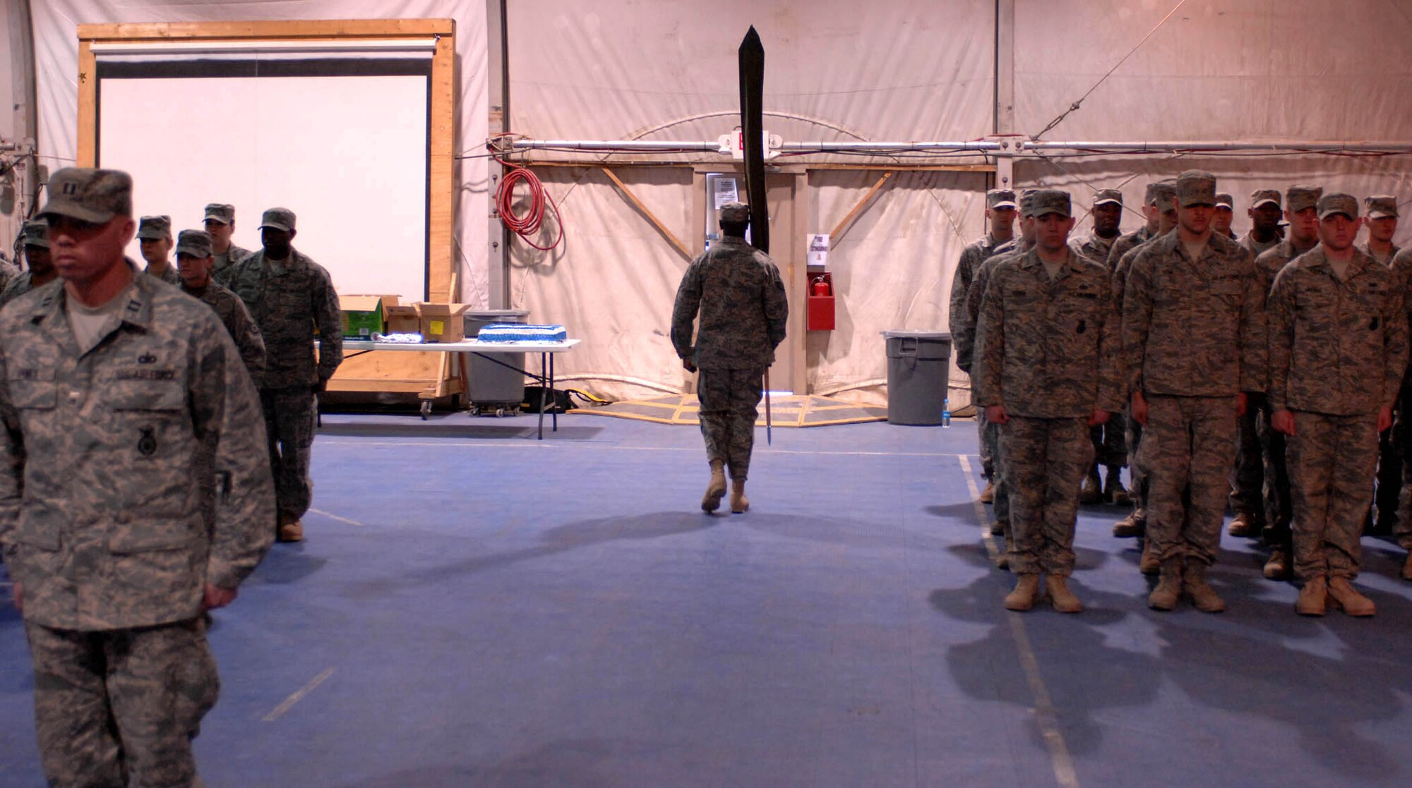 The 755th Expeditionary Security Forces Squadron guidon is carried off Jan. 11 at Bagram Air Base, Afghanistan. The squadron, originally formed in May 2006 in response to a Army request for support of its detainee operations mission, was inactivated during a formal ceremony Jan. 11 here. (U.S. Air Force photo/Staff Sgt. Mike Andriacco) 
