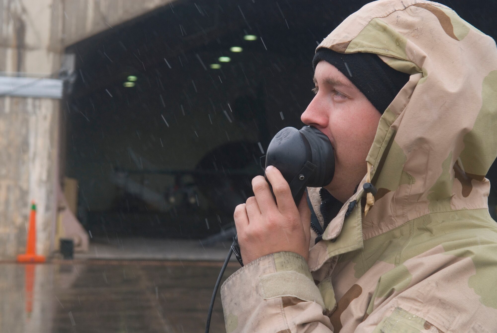 BALAD AIR BASE, Iraq -- Staff Sgt. Jeremy Crombie, a 332nd Expeditionary Aircraft Maintenance Unit avionics technician, speaks into a radio headset to check the status of avionics operations here, Jan. 11. The avionics system gives a pilot the capability to utilize the Joint Direct Attack Munitions on the F-16 Fighting Falcon. Sergeant Crombie is deployed from Spangdahlem Air Force Base, Germany. (U.S. Air Force photo/Staff Sgt. Joshua Garcia)