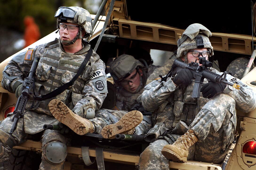 U.S. Army National Guard Spc. Nathean Hommer and Sgt. Willard Garmoe of the 186th Military Police Company, Iowa Army National Guard pull security duty in a simulated casualty extraction during mobilization training conducted by the 72nd Field Artillery Brigade on Fort Dix, N.J., Jan. 10, 2008. 