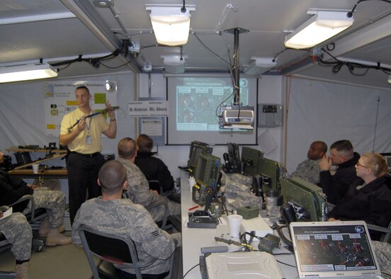 FORT BRAGG, N.C. - Mr. Jason Nickerson instructs Airmen, Sailors and Soldiers on Blue Force Tracker maintenance at Ft. Bragg’s Battle Command Training Center. The system uses the tactical internet, aided by satellite communications links when terrain features interrupt line-of-sight communication.  That constant flow of information puts leaders at all levels on the same page. Not just for keeping commanders aware of their forces’ locations at all times, the BFT provides answers to those whose boots are actually ‘on the ground.’  (U.S. Air Force photo/Capt. Ken Hall)