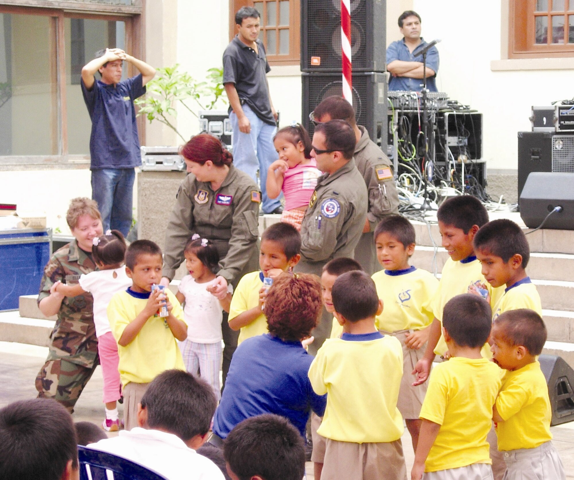 Aircrew members, including some from the 336th Air Refueling Squadron, visit with children at a local foster home Feb. 16 at Lima, Peru. Airmen in Peru wrapped up joint exercises Falcon and Condor 2007 and were remaining there for the first joint air
show with the Peruvian Air Force. The joint exercise and air show directly support U.S. Southern Command’s engagement goals and further relations between allied nations. (Courtesy photo)