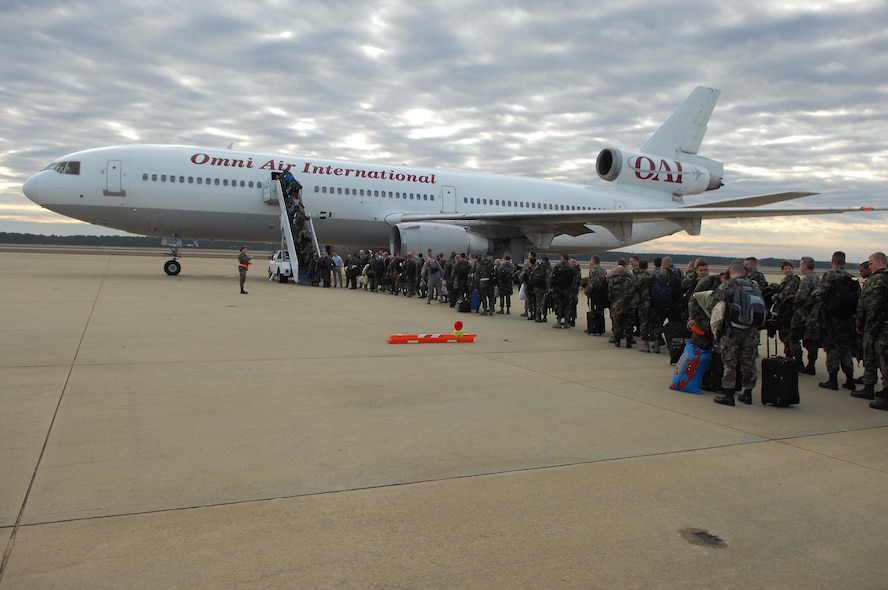 SHAW AIR FORCE BASE, S.C. -- Members of the 20th Fighter Wing board a plane for a deployment to the Pacific Air Forces theater Jan. 12. Nearly 300 Airmen from the 20th FW and about 20 F-16s from Shaw's 79th Fighter Squadron deployed as part of the Air Expeditionary Force rotation. (U.S. Air Force Photo/Staff Sgt Henry L. Hoegen Jr.)