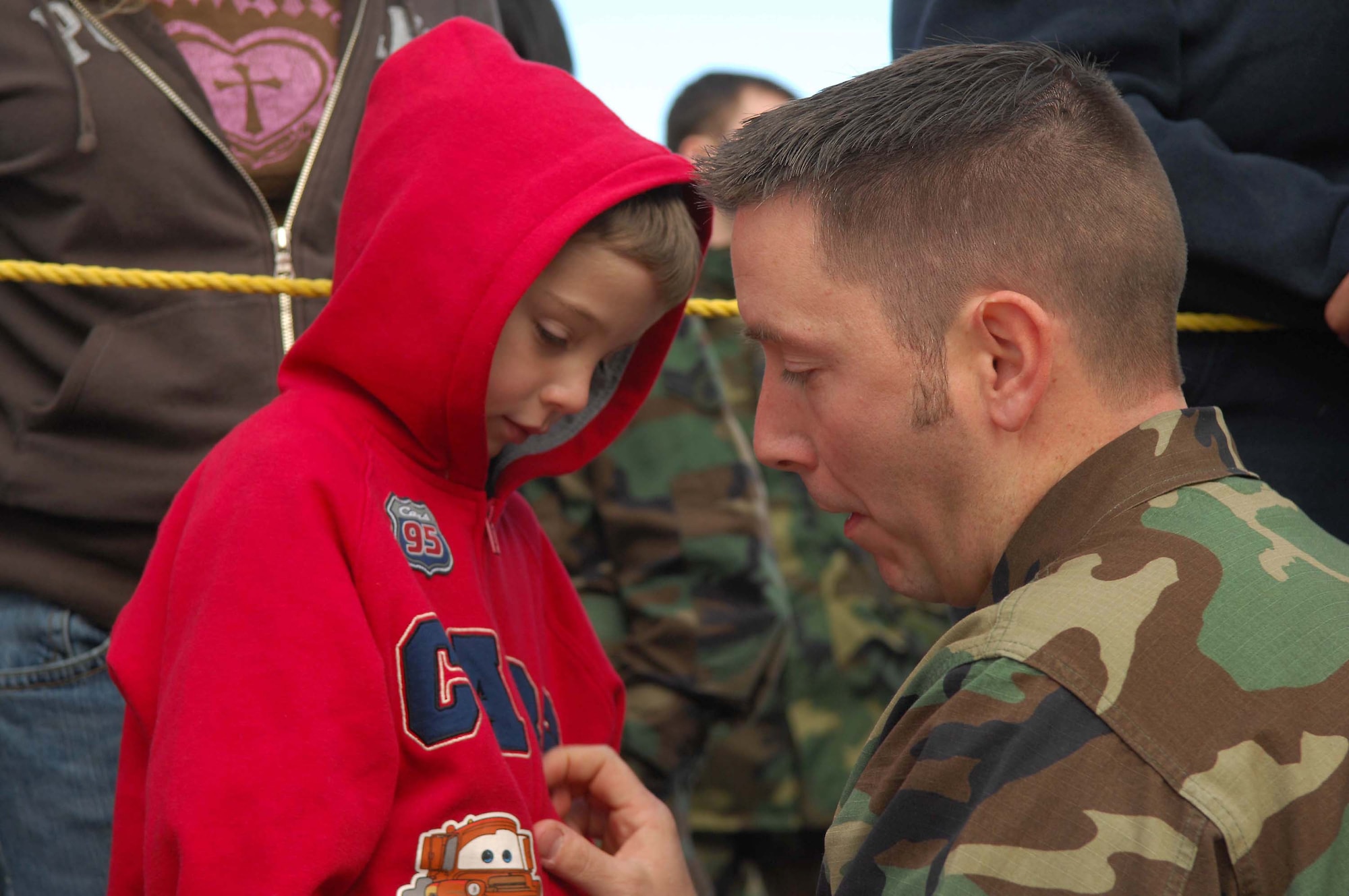 SHAW AIR FORCE BASE, S.C. -- Tech. Sgt David Skaggs, 20th Equipment Maintenance Squadron, says good bye to his son Micah before he boards the plane for a deployment to the Pacific Air Forces theater Jan. 12. (U.S. Air Force Photo/Staff Sgt Henry L. Hoegen Jr.)