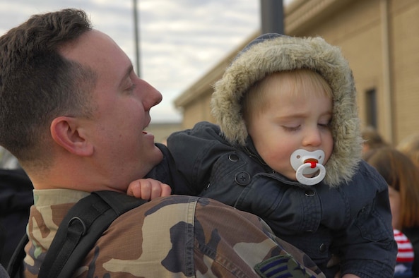 SHAW AIR FORCE BASE, S.C. -- Staff Sgt. Chris McDonald, 20th Equipment Maintenance Squadron, hugs his son Collin one last time before he boards the plane for a deployment to the Pacific Air Forces theater Jan. 12. (U.S. Air Force Photo/Staff Sgt Henry L. Hoegen Jr.)