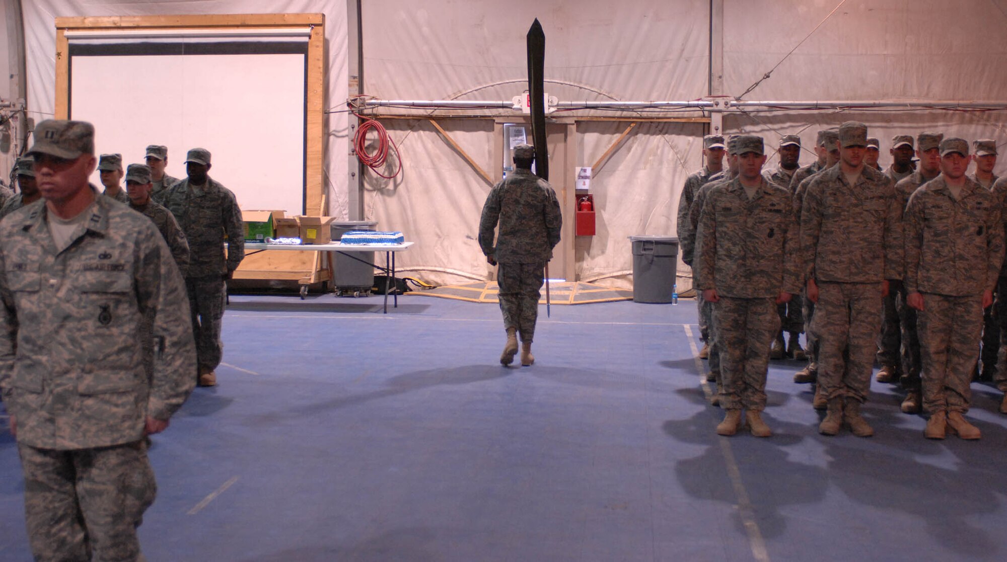 BAGRAM AIR BASE, Afghanistan – The 755th Expeditionary Security Forces Squadron guidon is carried off Jan. 11, 2008.  The squadron, originally formed in December 2005 in response to a U.S. Army request for support of its detainee operations mission, was inactivated during a formal ceremony here today. (U.S. Air Force photo by Staff Sgt. Mike Andriacco)